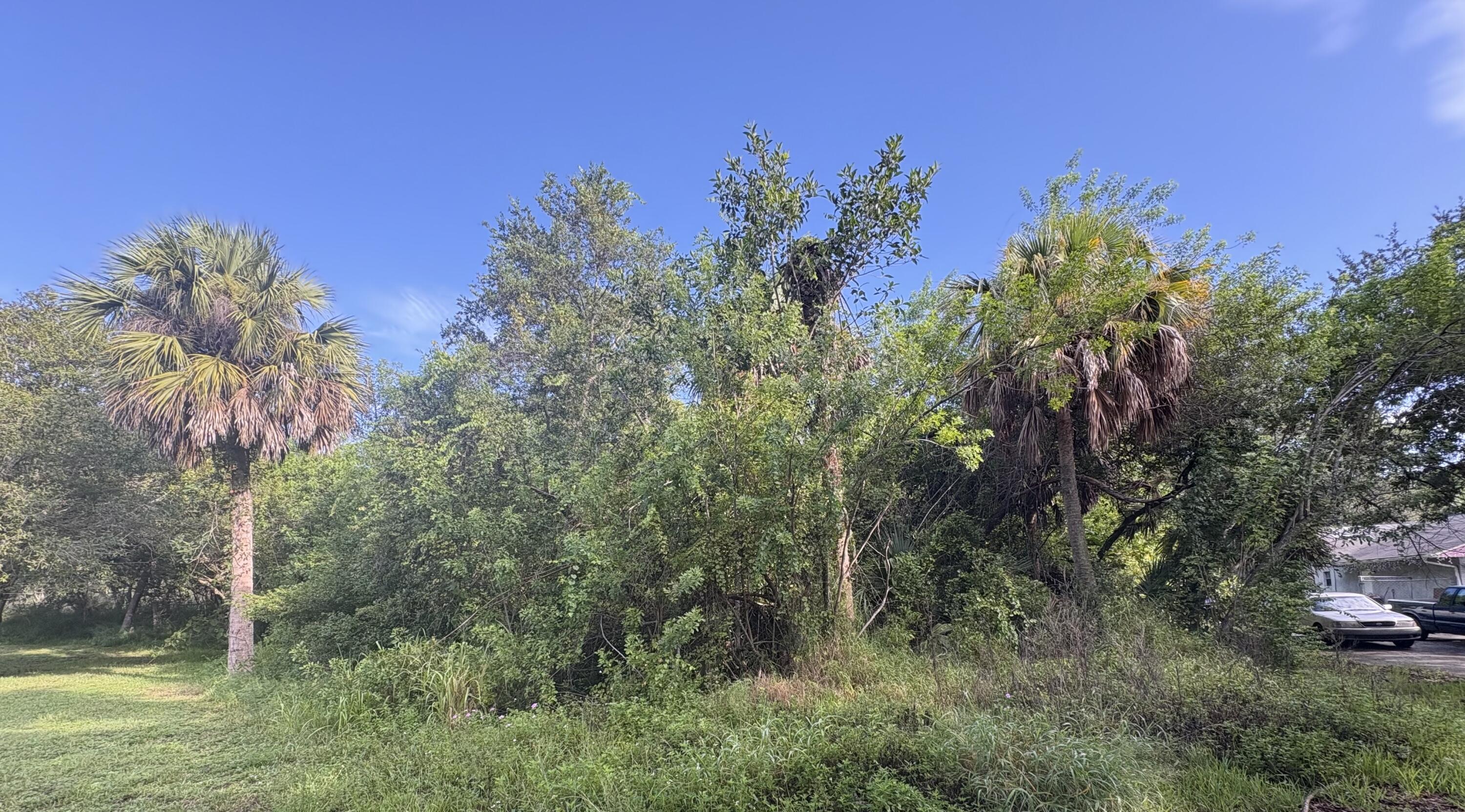 Build your dream home on this one of a kind triangular lot that backs up into a canal and cleared land on one side. Located just seconds from new built high school to be completed by January 2026 and now A rated school district. Minutes away from Interstate Highway and growing downtown. Become part of many projects coming to Fort Pierce. City water and low county taxes.