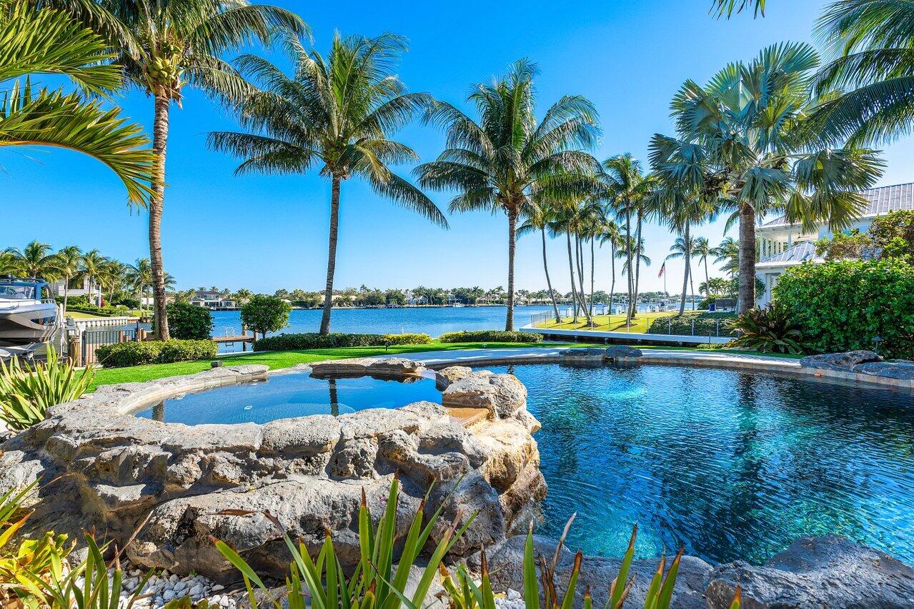 Discover coastal luxury at its finest. 350 feet of water frontage in the prestigious gated waterfront community of Captains Key. Hurricane 40K boat lift and pedestal with 50-amp service and automatic dusk-to-dawn lighting.
Primary suites on both the first and second floors, this home is thoughtfully designed for comfort and convenience. Soaring ceilings reaching 12 feet and higher, complemented by cutting-edge smart technology and an advanced air purification system throughout the home.
The chef's kitchen is a culinary dream, abundant counter space, two refrigerators, two dishwashers, two breakfast bars, and a six-burner gas cooktop with griddle, perfect for entertaining and gourmet creations.
Gorgeous home theater room to watch all your favorite movies and sporting events. Incredible resort-style backyard. The east-facing outdoor tropical oasis provides panoramic water views, a saltwater smart pool and spa, and a spacious patio with an expansive covered loggia. Entertain effortlessly with a new outdoor kitchen, equipped with premium Perlick appliances, including a refrigerator, ice maker, and a Sunfire grill. Seating around the fire pits and waterfall wall, setting the stage for unforgettable gatherings with family and friends  
Best restaurants, championship golf courses, shopping, beaches and PBI FBO all minutes away......