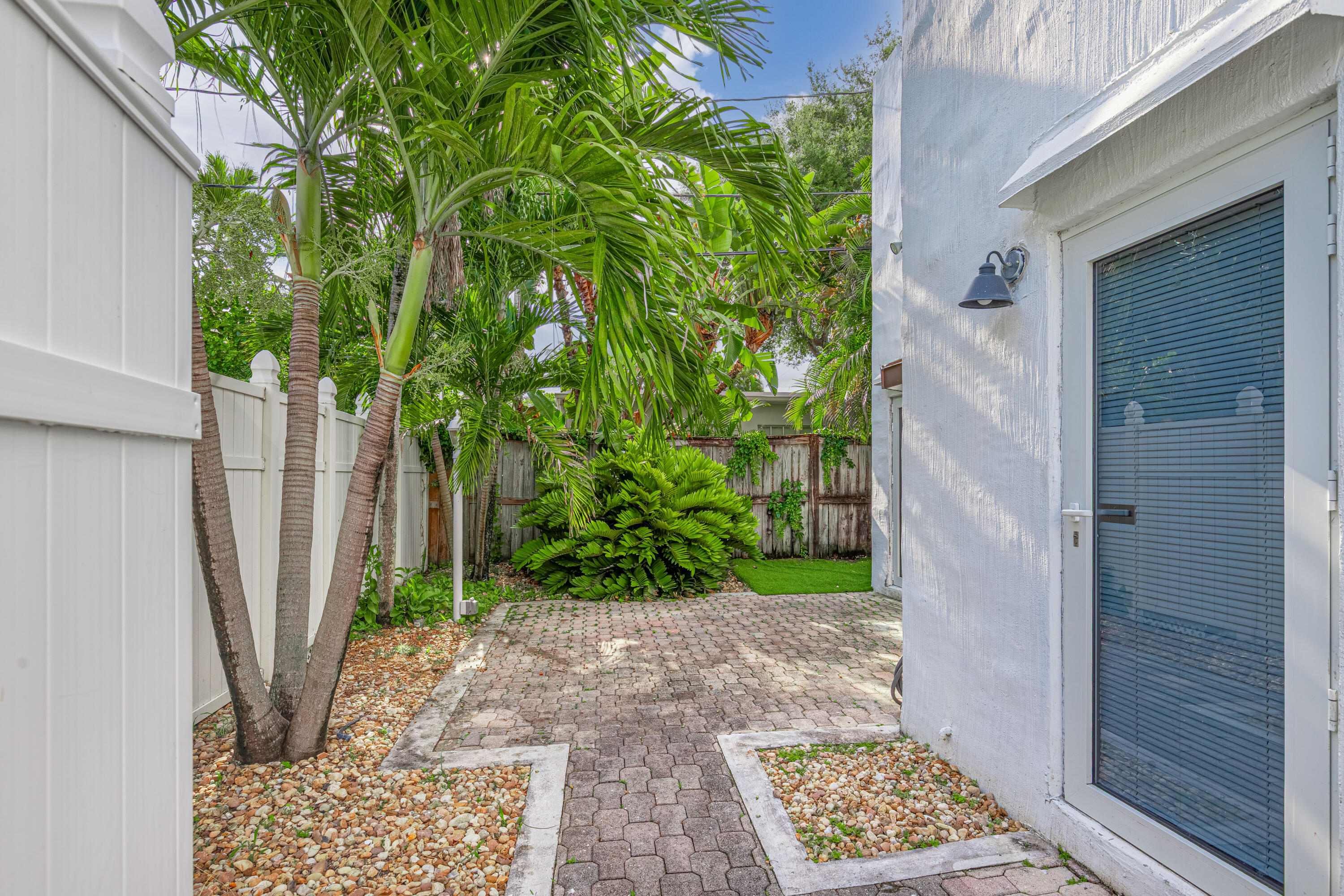 This 1935 multifamily represents a highly desirable investment or redevelopment opportunity in the Victoria Park neighborhood of Fort Lauderdale.  It balances structural versatility with a premier, walkable location near downtown, Las Olas and the beach.  Seven bedrooms and 5 bathrooms are configured as a triplex with two separate structures. The front building consists of two 2-bedroom, one bath units. Unit 1 has a private patio, the washer and dryer are shared.  The back building is a standalone single family home featuring 3 bedrooms and 3 bathrooms, a private patio and private interior laundry. There is off street parking for multiple vehicles.  The property has three separate electric meters and one water meter.  The front building is tenant occupied and the SFH is vacant.
