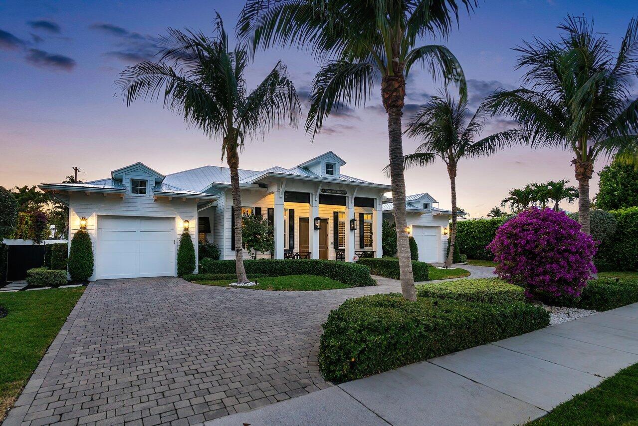Lake Ida is known for its tranquil atmosphere and collection of dazzling homes, but sometimes one simply stands out above the rest. Comprising 4,576 square feet across 4 bedrooms and 3.1 bathrooms, 1210 NW 3rd Ave is a residence crafted for enjoying an island lifestyle from the comfort of the mainland. Situated in a charming community centered around a picturesque freshwater lake, its location in the Lake Ida neighborhood offers scenic views and rests only a short drive from Delray's most beloved amenities, including Atlantic beach and the lively shopping and dining of Atlantic Avenue.  

Arriving to the front of the home via its circular driveway, the home's timeless Key West-style exterior and plantation shutters evoke the coastal lifestyle for which Delray Beach is so highly coveted. The covered porch leads to the entry and opens to the home's expansive great room, where natural light pours in through the windows and draws the eye to the space's breathtaking tongue and groove vaulted ceiling, all while being connected to the home's gorgeous loggia by sliding glass doors.  

The home's beautiful outdoor spaces are the centerpiece of the residence, with ample space for relaxing and entertaining in the beautiful South Florida weather. The home's spacious covered loggia is protected by dual motorized screens, one of which is for comfort and the other for hurricane protection. It includes a fully-equipped summer kitchen with a BBQ grill, fridge, and icemaker, and overlooks the luxurious heated saltwater chlorination pool with sun shelf, waterfall, remote-controlled multi-LED lighting system, and 3 fountains. Across from the pool, a spacious cabana includes a fridge, sink, outdoor fireplace and outdoor TV, all surrounded by a lushly and professionally landscaped yard that is flanked by travertine pavers, illuminated in the evenings by gas lanterns, and regularly maintained by Delray Garden Center. 

Once back inside, it becomes clear that the kitchen is the heart of the home, and includes quartz countertops with designer chevron marble backsplash, lighted glass upper cabinets, a roomy walk-in pantry, and gorgeous light-filled picture window. Features include a built-in Sub-Zero freezer and refrigerator, Wolf six-burner gas range with hood, double ovens and microwave, a built-in bar with glass cabinetry and undermount wine refrigerator, farmhouse porcelain sink, and a huge kitchen island with seating, additional storage and designer pendants.  

Elegant chandeliers illuminate the home's interior spaces and cast light onto myriad custom finishes throughout, which include European white oak floors, luxurious millwork, designer wallpaper, mirrors, and fixtures, and beautiful marble details in the home's bathrooms.  

Resting just beyond the kitchen is the home's primary suite, which enjoys sunny views of the backyard space and boasts a primary bathroom that is spacious enough to have its own sitting area, along with dual sinks with vanity seating, a huge soaking tub with chandelier, mother of pearl accent wall, freshly polished marble finishes, and a fully built out walk-in closet with island. Across from the great room, the secondary and tertiary bedrooms each include their own ensuite bathroom and walk-in closet, and the fourth is perfect to act as a den or private home office. The home also includes a powder room off the great room, a spacious laundry room with its own sink, and two separate single-car garages, one with its own EV charging station.  

Hurricane preparedness is at the forefront of the home's amenities, with impact glass windows, doors, and sliders, as well as a whole-home natural gas generator and whole-home water purification system to ensure that no storm will ever get in the way of comfort and serenity. Additional features include a built-in storage system in the garage, central vacuum, dual-zoned A/C system maintained by Island AC, and tankless hot water heater. Sonos speakers are installed throughout the home, security cameras are installed around the exterior, and custom draperies, TVs and furniture are negotiable, separate from the home sale.  

No matter what's going on outside its walls, it's impossible not to feel like you're enjoying an island vacation from the embrace of this beautiful Lake Ida home. Find the coastal serenity you would previously have had to travel for at 1210 NW 3rd Ave in Delray Beach. 

The information published and provided including but not limited to prices, measurements, square footages, lot sizes, features, finishes, and calculations are subject to errors, omissions or changes without notice.  All such information should be independently verified.  All parties should perform their own due diligence to verify all information.