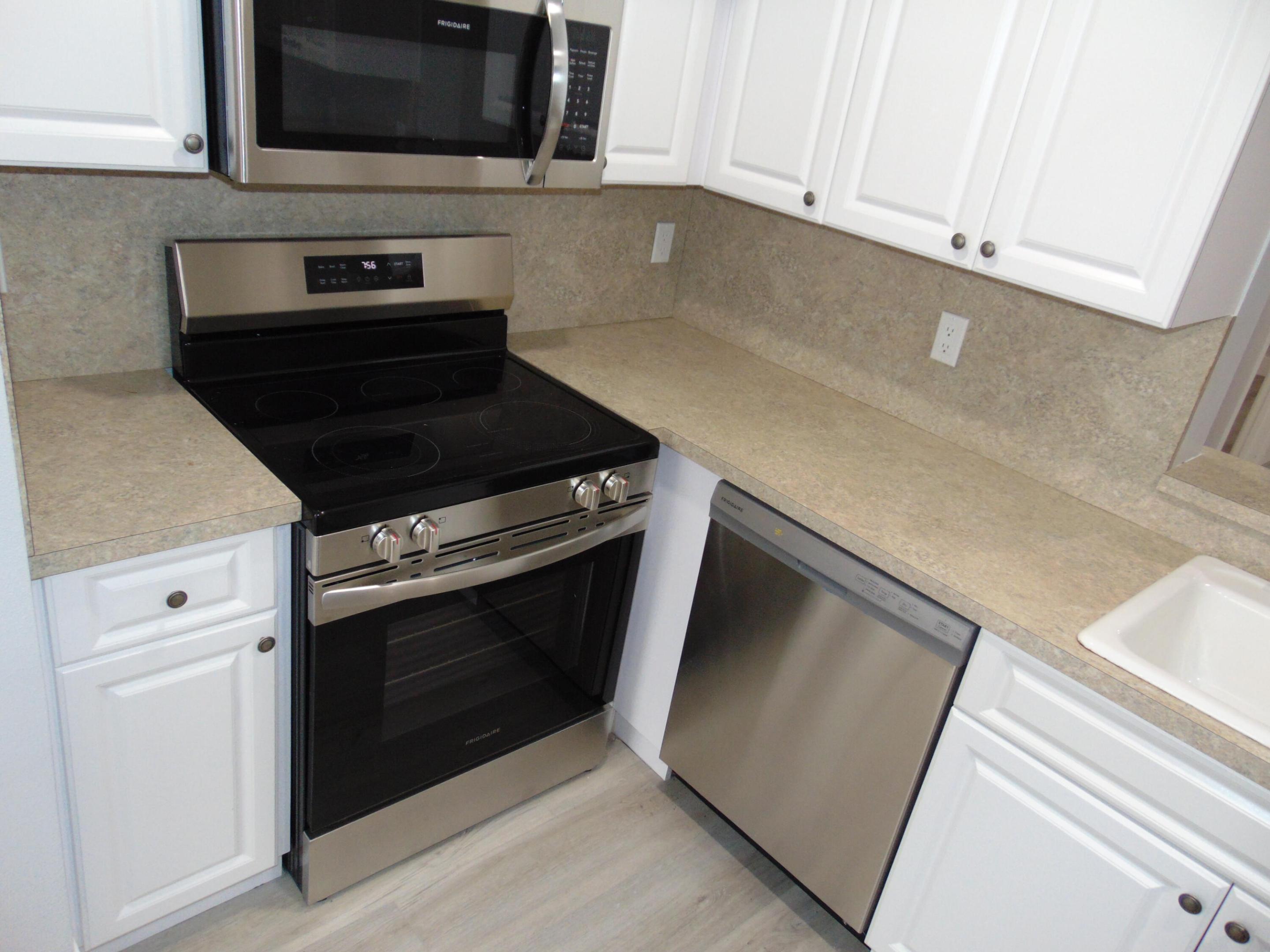 BEAUTIFUL ! MOVE RIGHT IN. GREAT UPDATED FIRST FLOOR CONDO IN POPULAR 55+ COMPLEX. EAT IN KITCHEN WITH LAUNDRY CLOSET FOR WASHER DRYER, STAINLESS APPLIANCES, SMOOTH TOP RANGE, BUILT IN MICROWAVE, STAINLESS DISHWASHER. BEAUTIFUL. 2 GORGEOUS BATHROOMS. FIRST FLOOR OPPORTUNITY TO OWN THIS FABULOUS UP TO DATE 2 BEDROOM 2 FULL BATHS. SMOOTH CEILINGS NO POPCORN. COMPLETE ACCORDIAN STORM SHUTTERS. 25 MINUTES TO BEACH. 25 MINUTES TO FT LAUDERDALE. NEAR CORAL SPRINGS RESTAURANT ROW. ROOFS REPLACED. LOCATED ON PUBLIC GOLF COURSE. NO MEMBERSHIP REQUIREMENTS. SPACIOUS LIVING ROOM WITH RECESSED LIGHTING. PARKING RIGHT IN FRONT OF UNIT. MOVE RIGHT IN. NO PROJECTS TO DO HERE... check Open Schedule and Just LOOK. OR CALL NOW. NEAR NEW SHOPPING CENTER. CALL NOW AND SEE YOU WILL BE GLAD YOU DID.