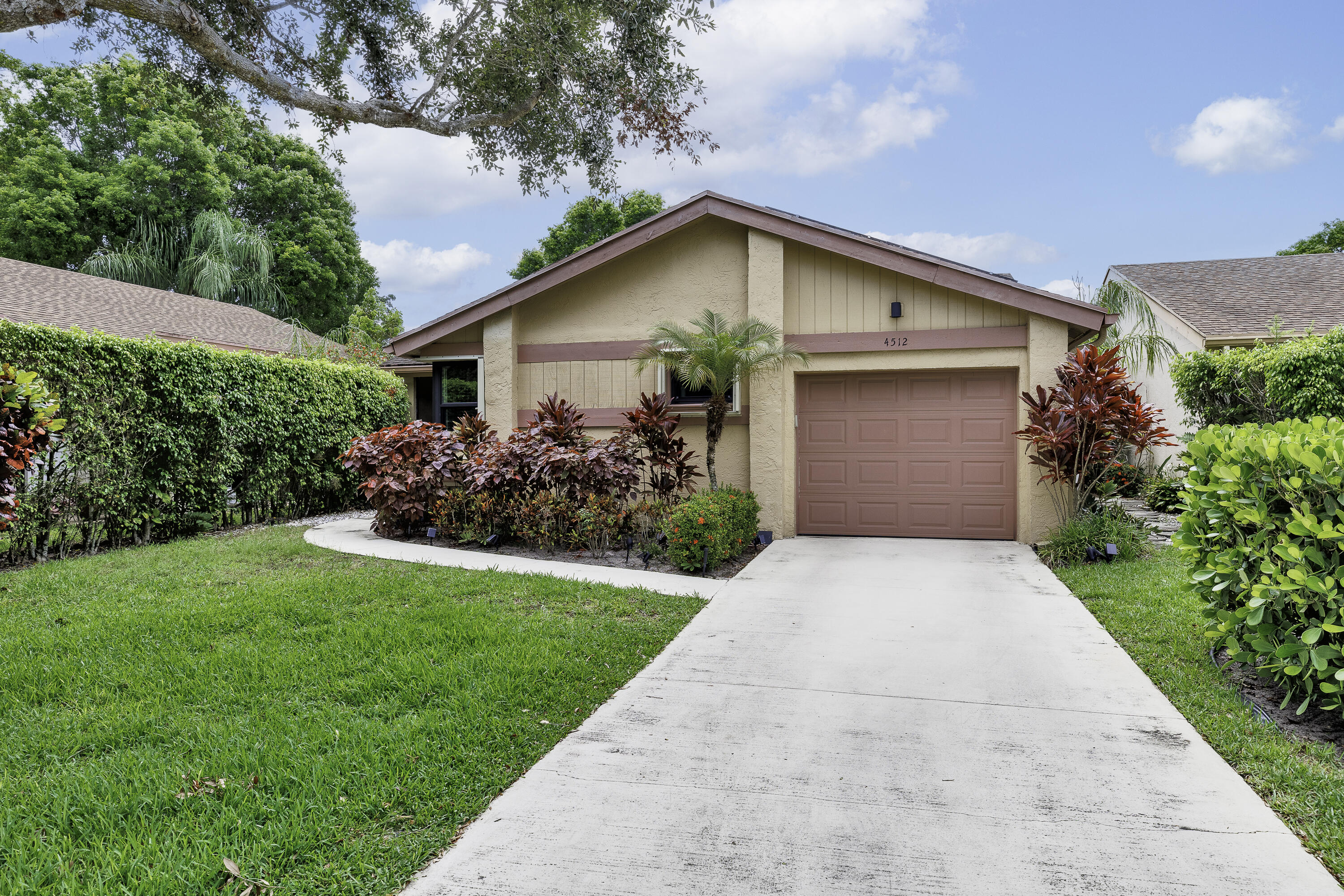 Discover this beautifully remodeled 2-bedroom, 2-bath lakefront home in one of Coconut Creek's most desirable 55+ communities. Featuring a stunning new kitchen, updated bathrooms, new tile flooring throughout, impact windows and doors, a brand-new AC system, and a fully paid-for solar panel system that helps keep electric costs to a minimum, this move-in-ready residence offers both style and efficiency. Enjoy breathtaking wide-water views, oversized living spaces, generously sized bedrooms, and a bright Florida Room where you can take in spectacular sunrises over the lake each morning. Outside, the spacious backyard shaded by mature trees creates a peaceful setting for relaxing or entertaining. Residents enjoy an exceptional an Olympic-sized swimming pool, fitness center and more.