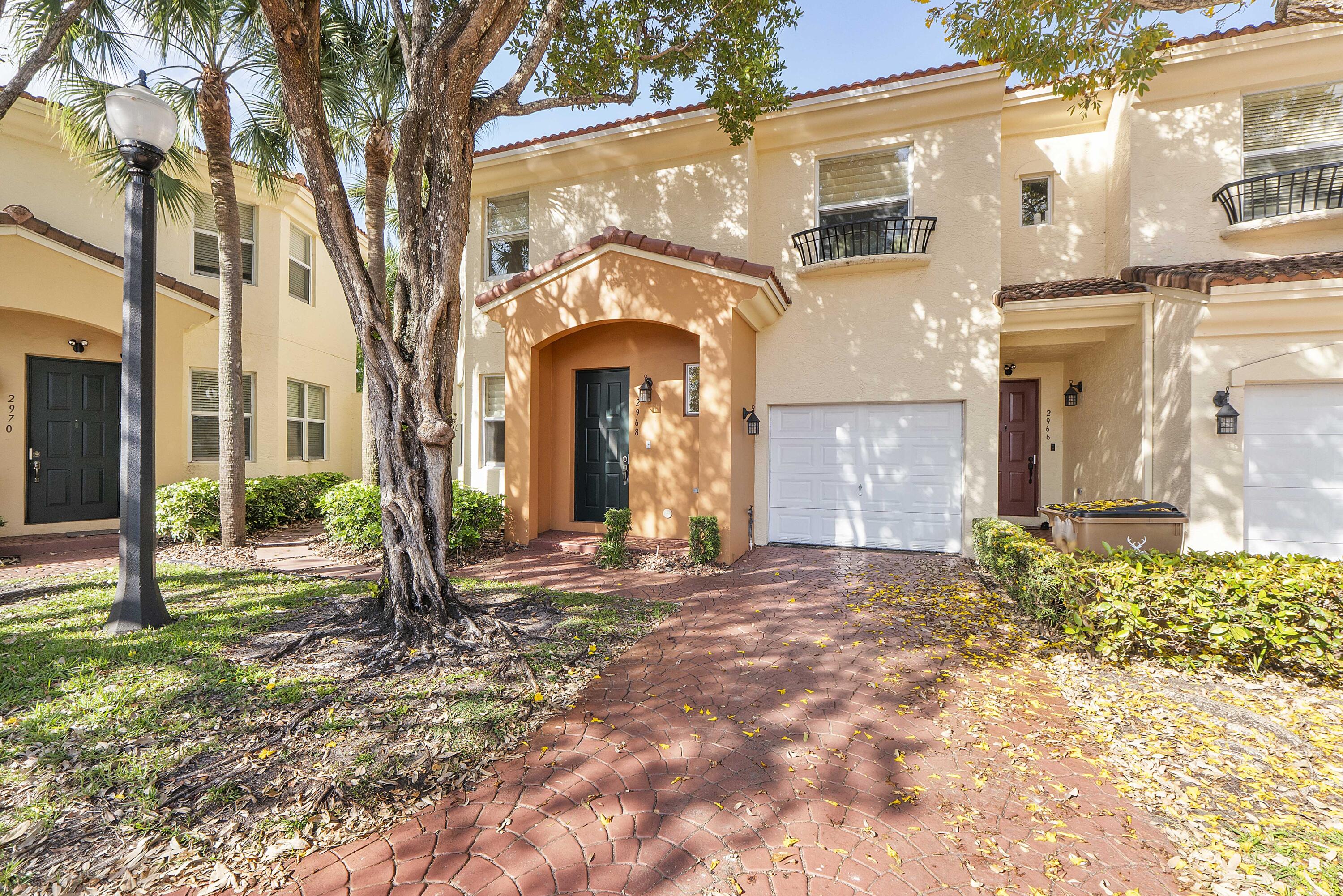 Beautiful CORNER townhome with over 1,700 SF in sought-after Deer Creek! INVESTOR FRIENDLY-NO WAITING PERIOD REQ. This 3BR/2.5BA home features ALL IMPACT WINDOWS & DOORS plus NEW ROOF & NEW A/C (2024) for peace of mind. Neutral 20" tile flooring, soaring 9' ceilings, & an oversized living room create the perfect space for entertaining. Timeless white kitchen w/breakfast bar opens to dining area & private patio-ideal for outdoor dining or relaxing. Spacious primary suite offers a large walk-in closet & ensuite bath w/dual sinks, soaking tub & separate shower. 1-car garage & driveway.  Ideally located near Deer Creek's public golf course & on-site restaurant, with the Arboretum & Constitution Park just steps away. Enjoy being only approximately 4 miles from beautiful Deerfield Beach.