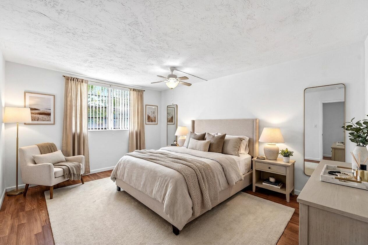 Bright, sunny 1 Bedroom, 1.5 Bathroom first floor End Unit condo with screened-in porch with an exit to your own private yard with a walled-in courtyard for your gardening or entertaining needs.  Unit is just steps to the community laundry room for convenience.  All ages community, no pets.  Secure entrance to condo hallway through lobby.  Omega 1 Condo is close to many schools, restaurants and shopping, centrally located in Plantation Florida.  Community amenities include clubhouse, pool, gym, racquet courts.