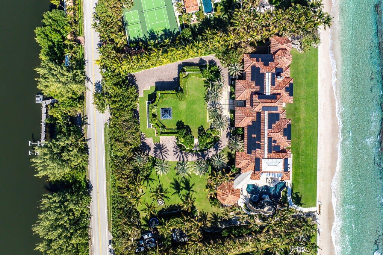 Ready for immediate occupancy. Magnificent Manalapan Modern Balinese inspired 2.83 acre estate, 34,498-square-foot full resort-style compound with unparalleled direct ocean views. Boasting 300+ feet of water frontage from ocean to Intracoastal making it one of the largest estates in Manalapan. Completely reimagined with recent upgrades and improvements including movie room, library, game rooms, wine room, ocean office, and several private lounges and flex spaces ensuring all needs are met.  Designed by the famed Marc-Michaels Interior Design Inc, this house comes fully custom furnished & turnkey!  This estate includes a total of 9 Bedrooms, 11.5 Baths, with 7 oceanfront suites and 2 lush guest garden suites. Both formal living room & family room have dramatic one of a kind 30ft floor to ceiling windows. A dedicated spa and wellness wing offers a gym, massage room, rain shower, and oceanfront yoga terrace. Outdoor highlights include expansive loggias, oceanfront balconies, a resort-style saltwater pool with waterfalls and waterslide, oversized spa, full outdoor kitchen, and lush tropical landscaping. A private deep-water dock provides direct ocean access via multiple inlets, completing this rare oceanfront and boating estate in prestigious Manalapan.   This property is being offered fully furnished as is now, with an exclusion list to be provided for some small personal items.  DISCLAIMER: Information published or otherwise provided by the listing company & its representatives is deemed reliable but not guaranteed are is subject to errors, omissions, or changes without notice. All information should be independently verified by any prospective buyer or seller. Listing company expressly disclaims any warranty or representation regarding such information.
