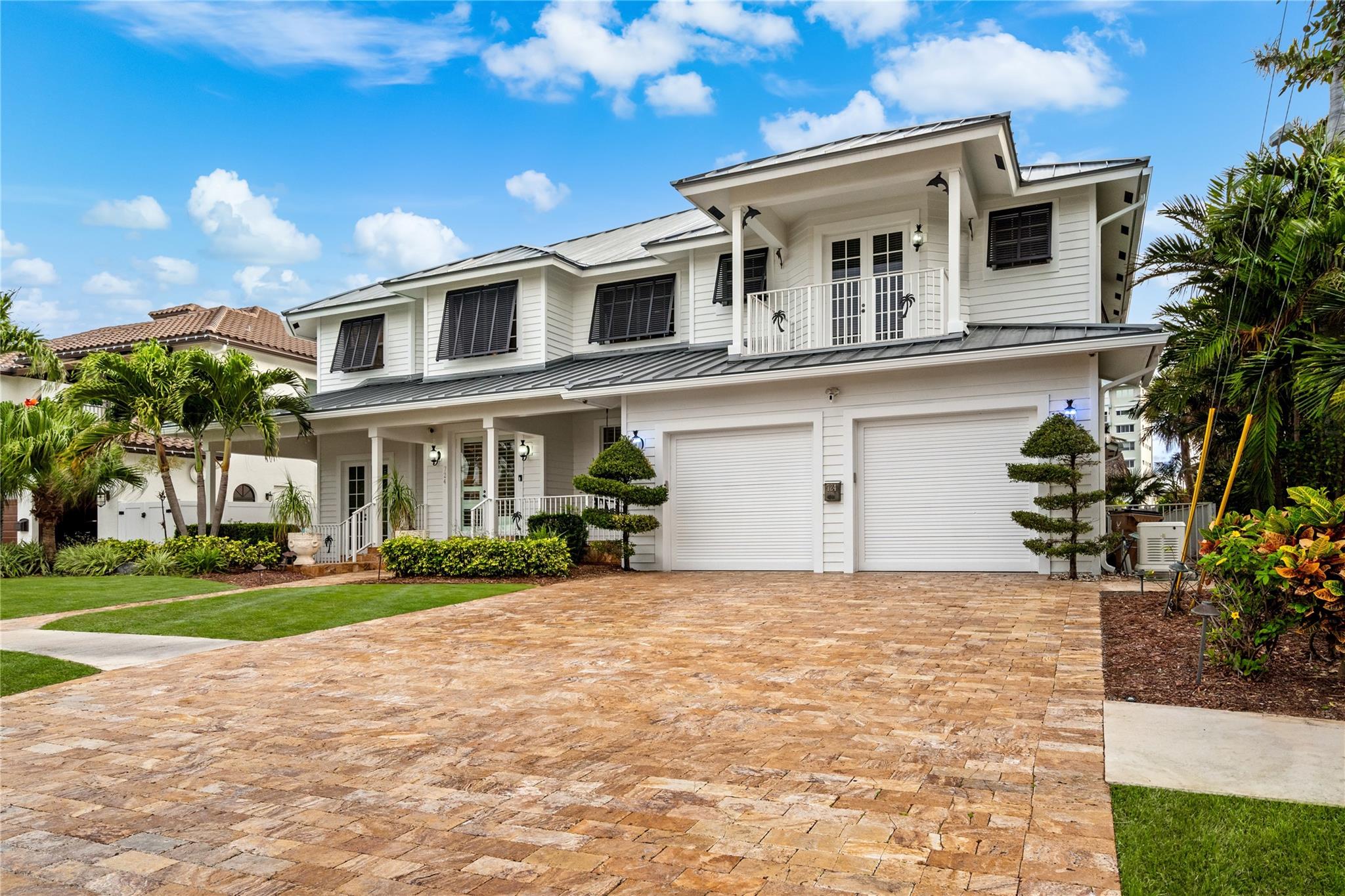 This airy split-plan lifestyle residence offers the utmost in personal privacy, luxury and serenity. Thematically designed to transport you, it provides exceptional waterway views, a two-story entry foyer with sweeping wood staircase, an inspired coquina living room fireplace, rich hardwood bedroom floors, weathered wood-look custom cabinetry, a covered lanai by a waterside pool with spillover spa, all defined by travertine pavers, Bahamian shutters, and its very own Tiki hut. The avid boater will enjoy a full-service private dock with 10,000± pound boatlift and easy ocean access through the Boca Raton and Hillsboro Inlets. The newly refinished resort-style pool/spa, and covered lanai with full summer kitchen ensure waterfront alfresco dining and easy entertaining. DISCLAIMER: Information published or otherwise provided by the listing company and its representatives including but not limited to prices, measurements, square footages, lot sizes, calculations, statistics, and videos are deemed reliable but are not guaranteed and are subject to errors, omissions or changes without notice. All such information should be independently verified by any prospective purchaser or seller. Parties should perform their own due diligence to verify such information prior to a sale or listing. Listing company expressly disclaims any warranty or representation regarding such information. Prices published are either list price, sold price, and/or last asking price. The listing company participates in the Multiple Listing Service and IDX. The properties published as listed and sold are not necessarily exclusive to listing company and may be listed or have sold with other members of the Multiple Listing Service. Transactions where listing company represented both buyers and sellers are calculated as two sales. Some affiliations may not be applicable to certain geographic areas. ?Information published or otherwise provided by seller, listing company or its representatives is deemed reliable but are not guaranteed and subject to errors, omissions, or changes without notice. If your property is currently listed with another broker, please disregard any solicitation for services. Copyright 2024 by the listing company. All Rights Reserved.