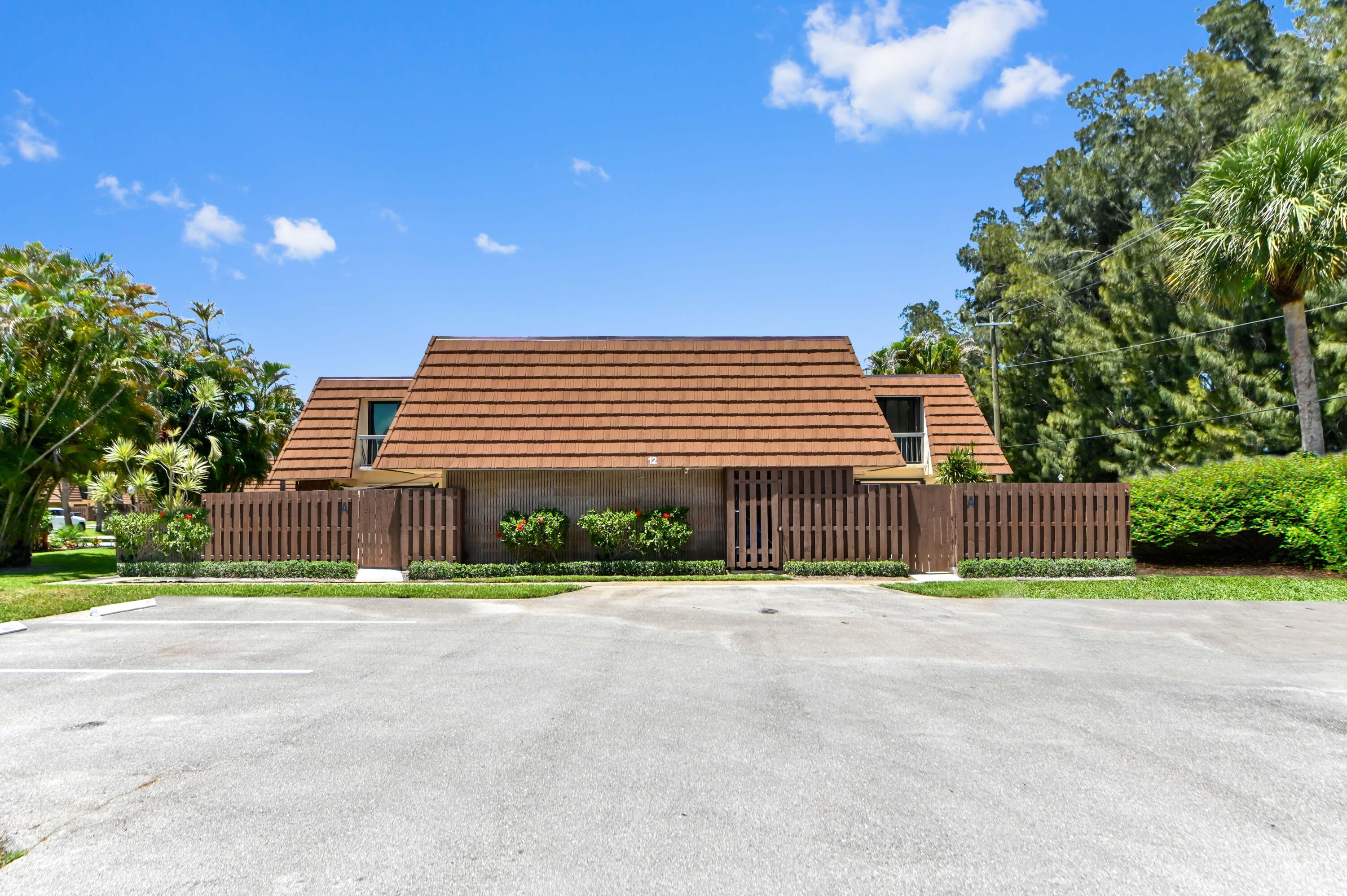 Live the ultimate Florida salt life without the commitment of buying! This beautifully updated 2-bedroom, 2.5-bathroom townhome is now available for rent in the highly sought-after water front community of Jupiter Plantation. Pets are welcome (see restrictions) and Cable/Internet is included in rent! Tucked away in a quiet, peaceful corner set safely back from road traffic, this Loxahatchee Riverfront community offers a low-maintenance, resort-style lifestyle right at your doorstep.  The layout is perfectly designed for shared living, a home office setup, or hosting guests, featuring dual primary suites on the upper level. Each spacious bedroom includes a beautifully renovated en-suite. On the main floor, the bright, open-concept living area and a convenient half-bath.  The modern kitchen comes fully equipped for your daily needs with stainless steel appliances, elegant granite countertops, and ample cabinet space. The inviting living area also features a fully functional fireplace, creating a warm and cozy atmosphere perfect for relaxing evenings at home. Step outside to your private, fully fenced open patio—an ideal space for weekend grilling, entertaining, or just enjoying your morning coffee. Adventure enthusiasts will highly value the custom, oversized storage closet built directly into the patio fence, specifically designed to securely hold kayaks, paddleboards, and beach gear. For your day-to-day convenience, an in-unit washer and dryer are included, along with generous walk-in closet space.  Renting in Jupiter Plantation means premium amenities are included in your everyday life. Enjoy access to a heated community swimming pool right on the riverfront, on-site tennis and pickleball courts, a dedicated community dog park, and a community boat dock with direct ocean access. Centrally located in the heart of Jupiter, this rental provides an incredibly convenient commute with quick access to I-95 and the Florida Turnpike. You are also just minutes away from Loxahatchee River launch spots, pristine beaches, world-class shopping, and top-rated local dining. Don't miss out on this incredible rental opportunity. Inquire today to review leasing terms and schedule your private tour!