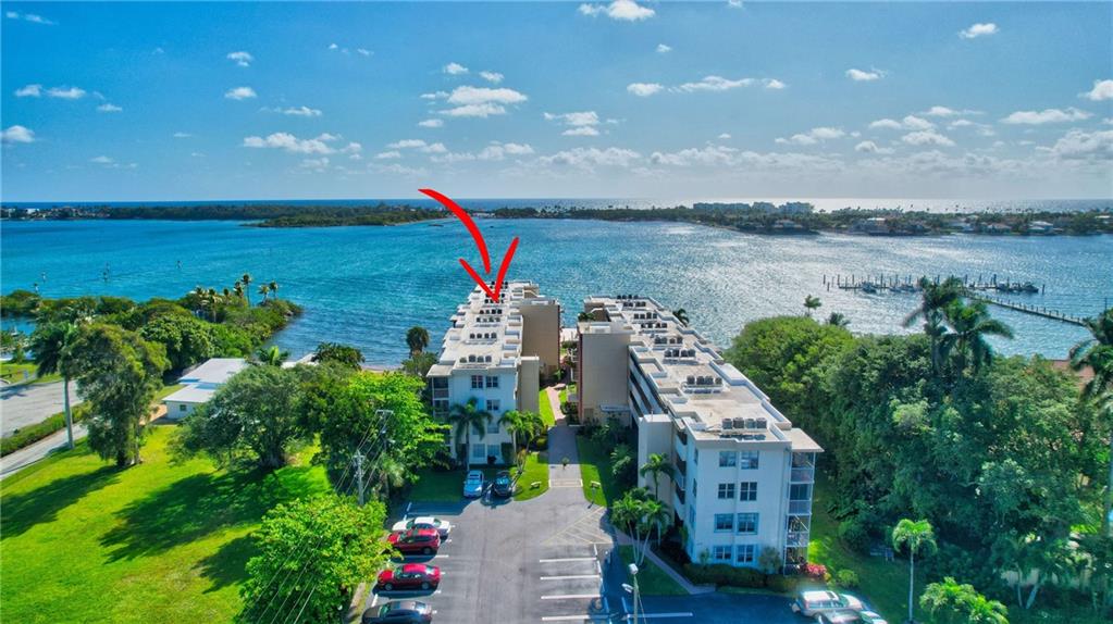 This charming 2 bedroom 2 bath waterfront condo is the perfect place to call home in sunny Florida. Located in a desirable area, this cozy retreat offers breathtaking views of the Intracoastal from all the main rooms and easy access to all the region's best amenities. The community pool is located adjacent to the Intracoastal, has magnificent water views, and is perfect for relaxing or socializing. Seacrest Villas is a 55+ community. This classic condo is ready for you to make it your own!