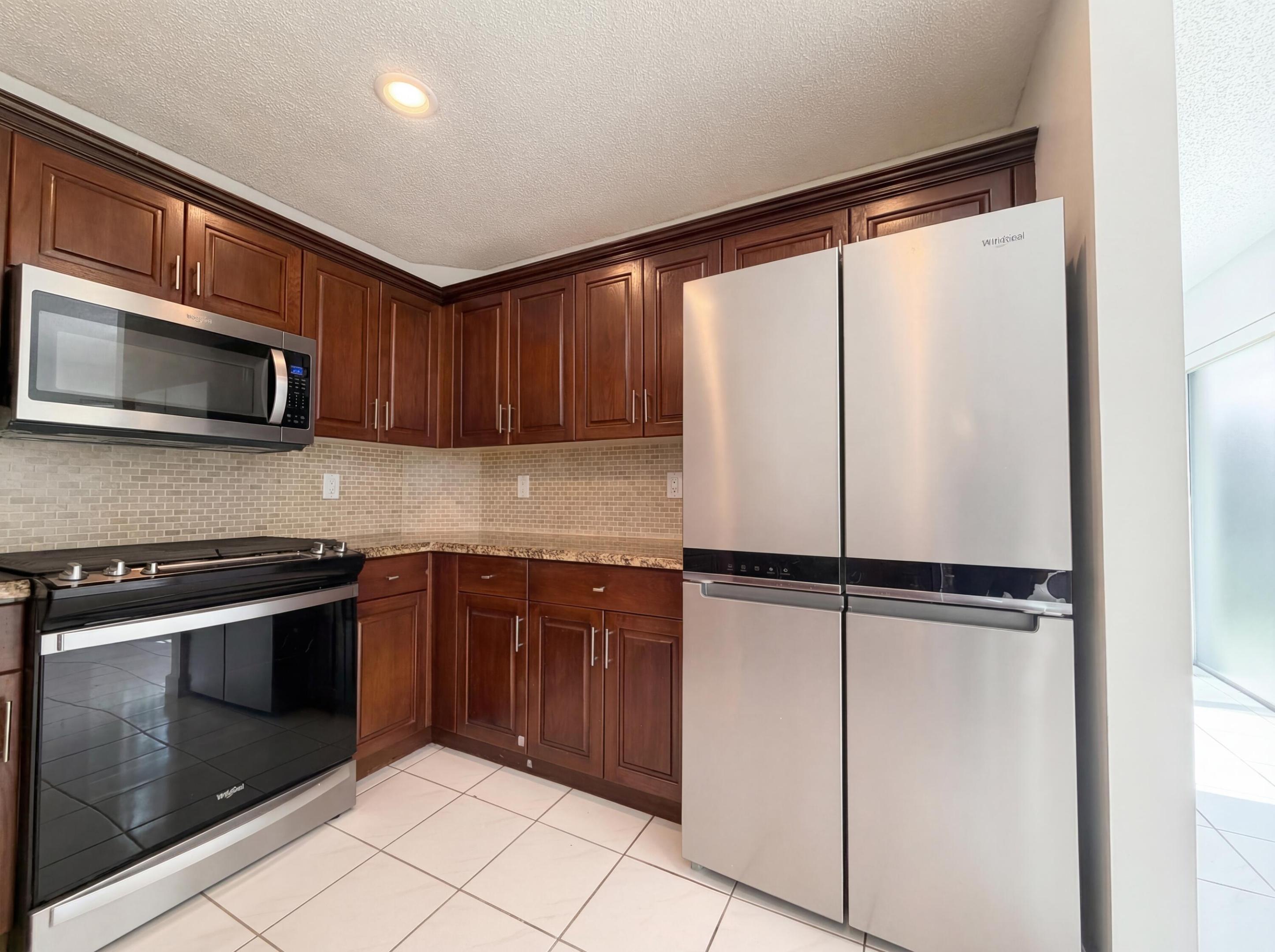 Imagine 73 Gables Blvd, designed for everyday comfort with a practical layout. The kitchen features all stainless steel appliances and an accent backsplash, while the primary bedroom includes a walk in closet and a primary bathroom with double sinks and a jacuzzi tub. Outside, a covered patio  are situated within a fenced backyard. A must-see for integrated style and functional comfort. Included 100-Day Home Warranty with buyer activation