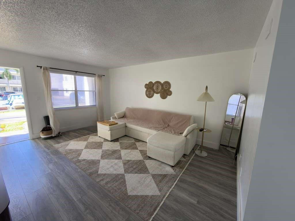 Beautiful 1-bedroom, 1-bath unit available immediately in the heart of Hollywood. Spacious layout featuring a large bedroom with walk-in closet and updated bathroom with stand-up glass shower. Freshly painted with newer laminate flooring and updated kitchen sink. First-floor unit, rarely available in the building. Hurricane shutters on all windows. Assigned parking space plus guest parking available. Laundry facilities located on the second floor. Additional storage included.  Prime location just a short walk to Downtown Hollywood with shops, dining, and entertainment. Minutes to beaches and major highways. Ideal for investors or end users.