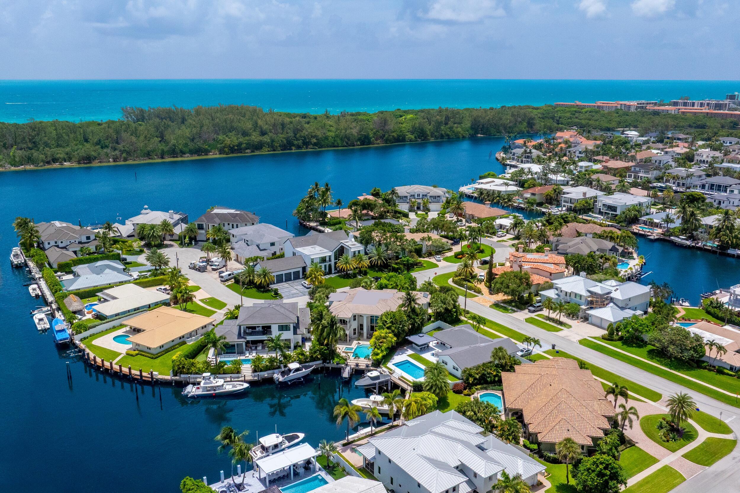 An expression of Mediterranean grace and modern refinement, Villa Aria is an exquisite waterfront estate, masterfully reimagined in 2022 to offer a lifestyle of effortless elegance and resort caliber comfort. Commanding a prominent corner parcel on .31 acres with 43 feet of water frontage and approximately a 50 foot dock, this architectural jewel is defined by its grand scale, luminous interiors, and elevated living experience. Villa Aria offers deepwater access via a private dock and is ideally positioned just minutes from the Intracoastal Waterway and Atlantic Ocean. With no fixed bridges to navigate, the property provides seamless access for boating and waterway excursions. Enter through a sweeping motor court framed by covered port cocheres, where a sense of quiet grandeur begins to unfold. Inside, soaring ceilings, bespoke finishes, and a gracious flow between formal and informal living spaces create a warm yet polished atmosphere.

Every element has been thoughtfully curated, from the newly redesigned landscape and pool to the impeccable interiors.
The gourmet kitchen is a statement of culinary sophistication, featuring a 6 burner Thermador gas range, Viking refrigerator and freezer columns, warming drawer, built in bar, dual dishwashers, and an ice maker, all anchored by Cambria quartz ironsbridge countertops and backsplash. Designed with both intimate living and grand scale entertaining in mind, the residence offers a formal dining room, a private office, and a state of the art home theater with its own dedicated powder room.

Each of the gracious bedroom suites has been luxuriously updated with en suite baths, while the primary suite is a private sanctuary, complete with a sitting area, dual walk in closets, two spa inspired bathrooms, and a tranquil balcony overlooking the water.

Outdoors, the entire backyard has been thoughtfully reimagined. The pool has been completely refinished and paired with an all new pool system to match the newly installed stone pavers that extend throughout the patio. A fully equipped outdoor kitchen and elegant lounge areas create a seamless flow for entertaining. The updated dock accommodates both a boat and a jet ski, offering ideal access to South Florida's waterways.

Additional appointments include a full cabana bath, first floor powder room, elevator, three car garage, four zone air conditioning, new tankless water heater completed in 2023, and a full house Kohler gas generator, delivering uninterrupted luxury at every turn.

Villa Aria is not simply a home. It is a sensorial experience, a true villa in every sense. Sophisticated yet soulful, modern yet timeless, this is Boca Raton waterfront living at its most refined.