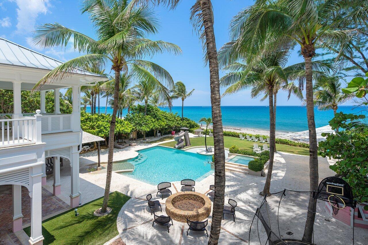 If perfection is what you seek then 6275 N. Ocean Blvd. Ocean Ridge, a magnificent Oceanfront Estate, meets your discerning taste. Exquisitely framed to capture unrivaled ocean views and breathtaking sunrises, this oceanfront home pairs a cool beach design with impeccable finishes using natural materials and textures sourced from around the world. Encompassing 17,183 TSF, 8 BB including 2 bunkrooms and 6.3 BA. The home exudes a warmth and ''everyone welcome'' vibe. Upon entering, guests and family are greeted by a spacious flexible living space with soaring ceiling heights and nano doors seamlessly opening to incorporate the interior and exterior space while infusing natural light and sweeping ocean views. Boasting a masterfully styled epicurean kitchen with fully equipped butler's room, t -shelf appliances, 3 full refrigerators, 3 dishwashers, a coffee center, and fine custom cabinetry. The 15-foot kitchen island adjacent to the inviting gathering room are perfectly suited for the best of chefs and casual fun-filled dining. Privately located on the first floor are his/her offices. Hers with a spacious hobby room and direct ocean views, his with grade A millwork on walls and ceilings and a large entertainment and bar area. Evoking memories of childhood for those special family members enjoyment, an Alice-in Wonderland-like play area, and media room. The second-floor luxury oceanside master bedroom features oversized walk-in closets and separate bath areas which bring a sense of Zen and harmony within its doors. A private master balcony with endless ocean and sand vistas offers a seductive pull to unwind and surround yourself with nature.  Four additional guest suites with balconies plus a separate second-floor guest house features a large bedroom/ bath, morning kitchen and sitting area. To be charmed and dazzled venture to the outdoors where an unparalleled sense of adventure abounds. The grounds offer swaths of lush lawn, a pool/spa with water slide, loggia and tiki hut with intricate wood ceilings and lots of beach storage. The estate is lushly surrounded by extensive verdant landscape and long winding sandy paths which lead to a private and quiet beach.  Completing the offering is a motor court with a four-car-garage, Chicago brick and shell stone drive, two full laundry rooms, 2 outdoor showers, impact windows/doors, a screening room and gift-wrapping room, just to name a few.  Connoisseurs the world over will covet this rare oceanfront estate.  

Superb restaurants serving diverse cuisines, flourish nearby and boutique shopping abounds along Atlantic Avenue and Worth Avenue. Not many homes offer this type of quite retreat that is also close to Delray Beach and the convenience for which Palm beach County is famous. Your favorite part of going out will be coming home to your sumptuous oceanfront estate.