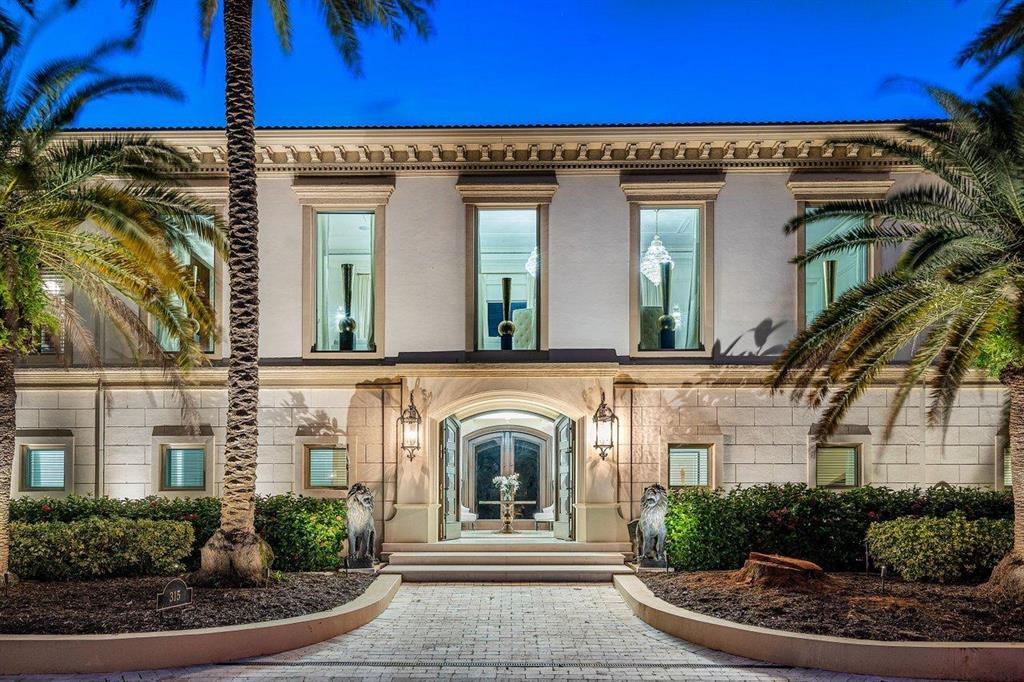 This Gatsby-like mansion is an entertainer's galore! The elegant waterway estate is located in the highly sought after Royal Plaza Drive, in the prestigious Las Olas Isles. Boasting over 35,229 square feet on a triple waterfront lot, and featuring over 12,000 square feet of living space, 310 feet of water frontage, a 1,600 square foot outdoor terrace, a 5,000 bottle wine cellar, and a separate guest house equipped with a custom collector's lounge and showroom, which allows you to showcase your luxury cars in the comfort of your own home. 

The property features glamorous chandeliers throughout, high-end finishes in all bathrooms and the kitchen, beautiful millwork throughout the home, grand staircases, hidden passages, high ceilings, elegant water features...... elevated common spaces with soaring waterway views, a grand ballroom, an elaborate formal dining room for 14, and a 2,000 square foot master suite with double-height ceilings. The outdoor space brings endless entertainment options, with not only the sprawling rooftop terrace, but also the alluring pool deck and dock space - providing endless outdoor living possibilities.
