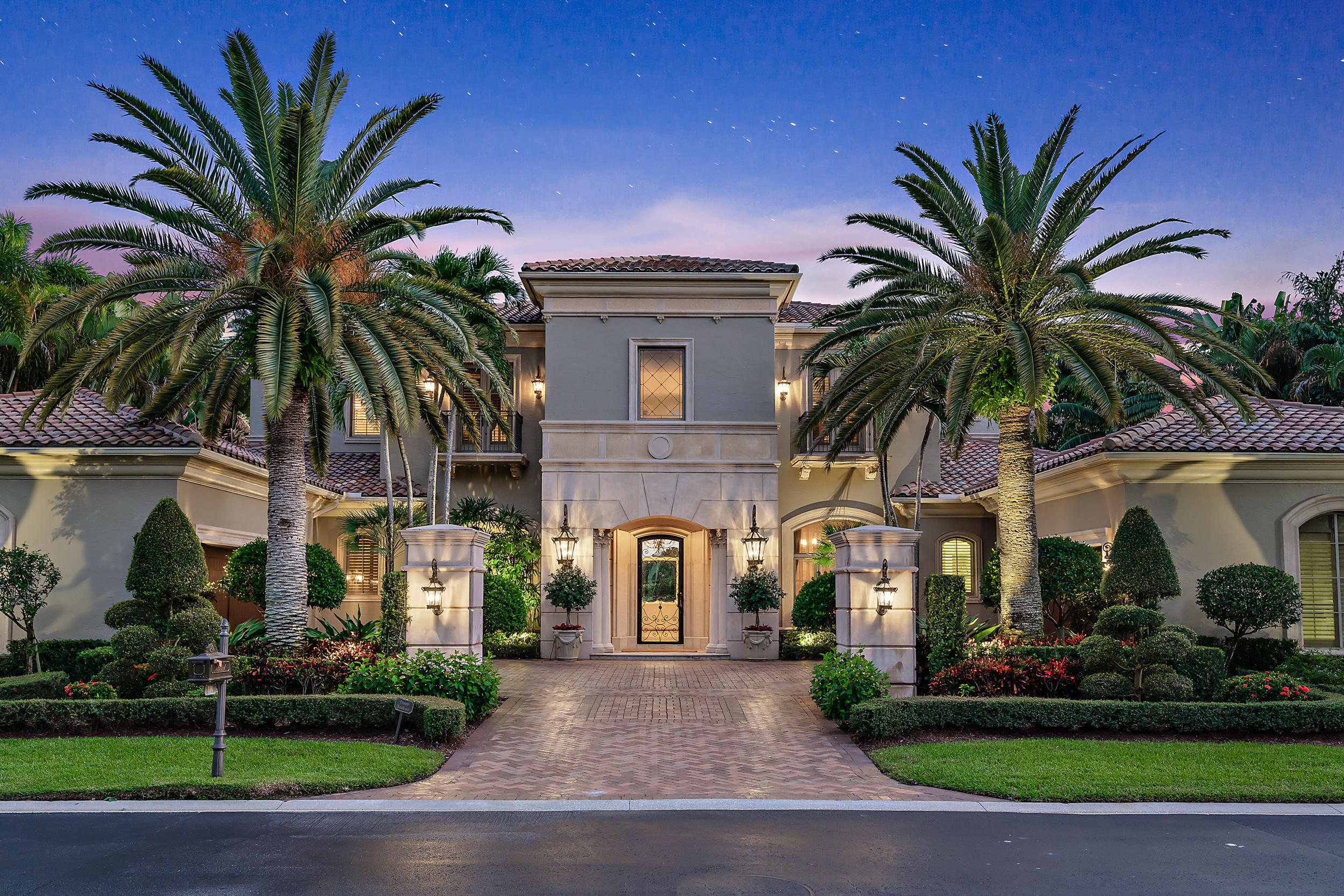 Located in the Country Club at Mirasol, 118 Via Palacio offers every upgrade your heart desires. This gorgeous waterfront property boasts over 7,800 sq. ft. of living area with 5 bedrooms and 6 plus powder room baths. The master suite has custom his/her closets his/her baths and breakfast kitchen.  A VIP guest suite is located on the first floor with three private balcony VIP suites on the second floor. Countless upgrades include a brand-new roof, hurricane impact windows and doors throughout, newer air conditioning systems and freshly painted exterior. 

You will be drawn in by the elegant motor court, 4 car garage, spa pool, impeccable landscaping, welcoming facade and stay for every incredible detail that follows in this meticulously maintained home. Golf Membership This waterfront beauty has it ALL! 

Beyond its breathtaking exterior, 118 Via Palacio offers every upgrade your heart desires. Through the impressive custom glass front door, you will find soaring ceilings and a grand foyer, the perfect gateway to this opulent property. Not a single detail was missed in the design of this flawless model homebuilt by Courchane Buildersfrom the Parador Domus marble floor to the 26' dome ceiling.

This elegant 7,892 sq ft home provides plenty of space for families and privacy for guests with 5 spacious bedrooms, 6.2 bathrooms, a library, wine room with redwood wine racking system and multiple areas for entertaining and relaxing. The gorgeous wood beam details, intricate crown moldings, and trim found throughout the home provide an added touch of sophistication.

The alluring radius staircase leads to 4 spacious bedrooms each with custom closets complete with Melamine built-ins, a library, second floor terraces, and well-appointed expertly decorated bathrooms.

The heart of this home is the exquisite top-of-the-line kitchen featuring an oversized island with a patina finish Jerusalem stone top, hood with limestone finish, stainless steel Dacor appliances, double ovens and stacked lit cabinetry.

The expansive first floor master suite with its sweeping views and high ceilings is the perfect place to relax and rejuvenate. The generous ensuite offers an oversized tub and his and hers showers with sleek frameless tempered glass enclosures. The massive custom his and hers walk-in-closets, built in vanity, wet bar and gorgeous light fixtures add to the grandeur of this master retreat.

The inviting grand room features an elegant Temco limestone fireplace and offers unobstructed views of the water and immaculate backyard sanctuary.

Dreaming of a getaway? Escape to this luxurious backyard oasis, featuring a custom pool complete with sun shelf, spa, and tranquil water features flowing into two separate holding pools with rills, surrounded by beautiful Mediterranean and Venezian gold pavers. The backyard is an entertainer's dream with an outdoor kitchen, bar, and grill overlooking the incredible views of the lake. Southern exposure and covered living and dining areas allow for year-round outdoor living.

Mirasol is a highly sought-after community in the Palm Beaches bounded by nature preserves and tranquil lakes. Mirasol offers excellent dining and social options, fitness center, spa, family-friendly Sports Complex, Tennis Center, plus two championship golf courses designed by legends Tom Fazio and Arthur Hills. Located just a short drive from pristine beaches, and extensive shopping in the Palm Beach Gardens area.

Full golf membership available. 

Do not let this one get away!