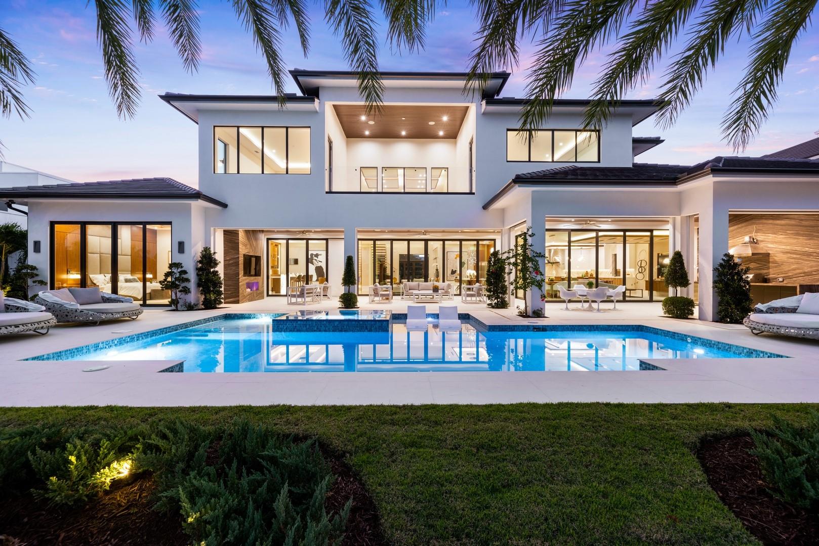 Located in Broward's newest guard-house security community of only 36 residences! Seeking the ultimate custom build design & quality? Recently completed brand new custom construction with no detail or budget spared. Situated in the most private & quiet section of The Enclave on oversized property overlooking 13th hole of the Robert Trent Jones golf course, stunning dramatically open fairway views! Designed for today's perfect SoFlo lifestyle entertaining flows seamlessly to expansive automatic screened outdoor Summer kitchen, living & dining areas. Great room offers two-sided fireplace with club/bar area, formal living & dining adjoins open & spacious family room & Chef's kitchen. Custom cabinetry & ceilings feature throughout. Bedroom accommodations include first & second primary suites.