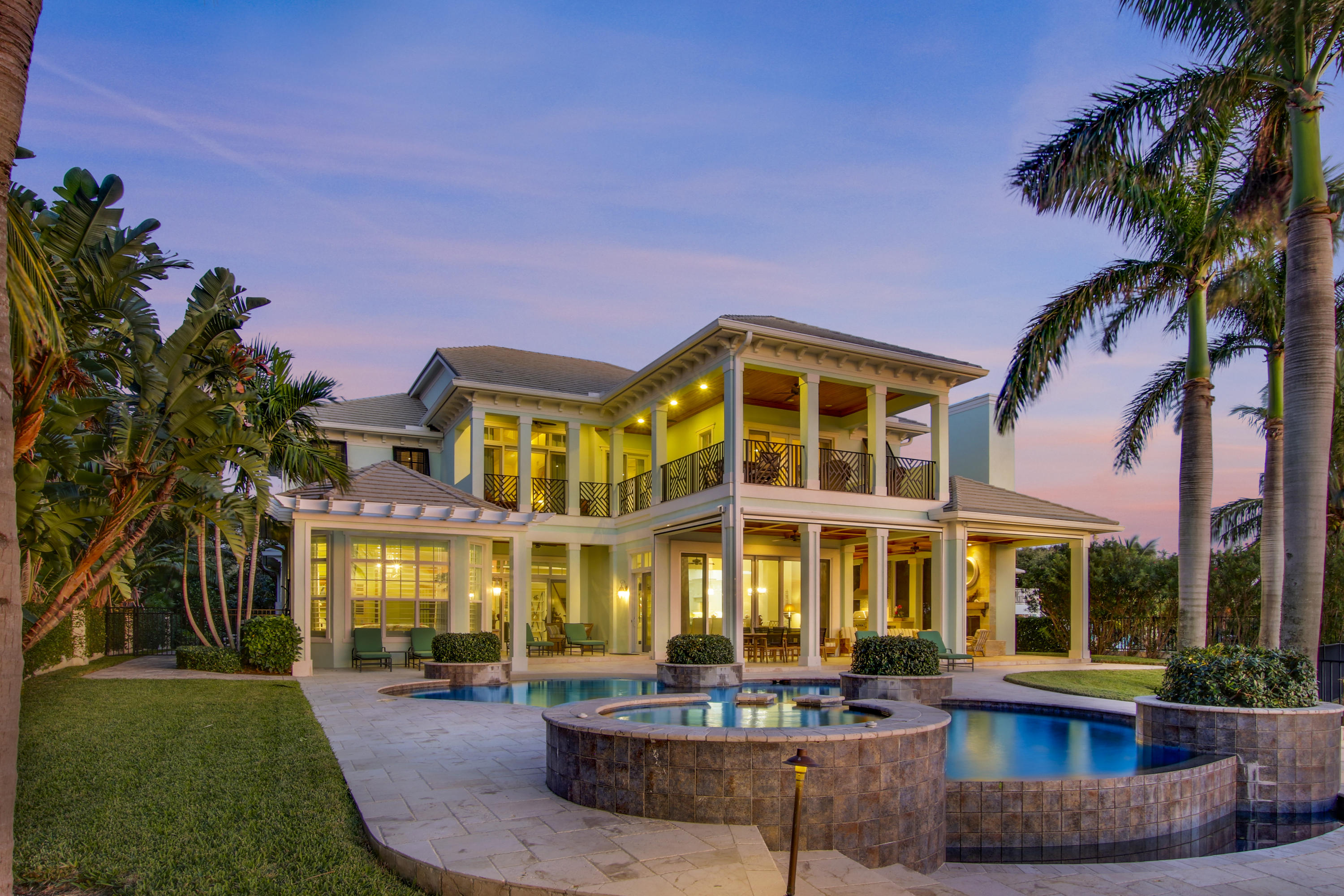 Deeded beach to river!  1.37 acres, 300'+ dock with 40,000 and 24,000 boat lifts, resin dock, etc.  2008 CBS construction, concrete/impact, brand new whole house generator.   7000+ AC living area, furnished, 6  bedroom, 6,5 bath, includes guest studio over garage.   Beautiful vistas and covered patio areas across the back of the residence and add'l balconies in front for cross ventilation and true south florida/tropical living.  Architectural appointments, open trusses, coffered ceilings, a visual masterpiece with glass impact sliders across the back for breathtaking water views and sunsets. Outdoor kitchen, fireplace, beach slope pool, with whirlpool, entirely fenced, gated with fish motif.  There's nothing like this one!