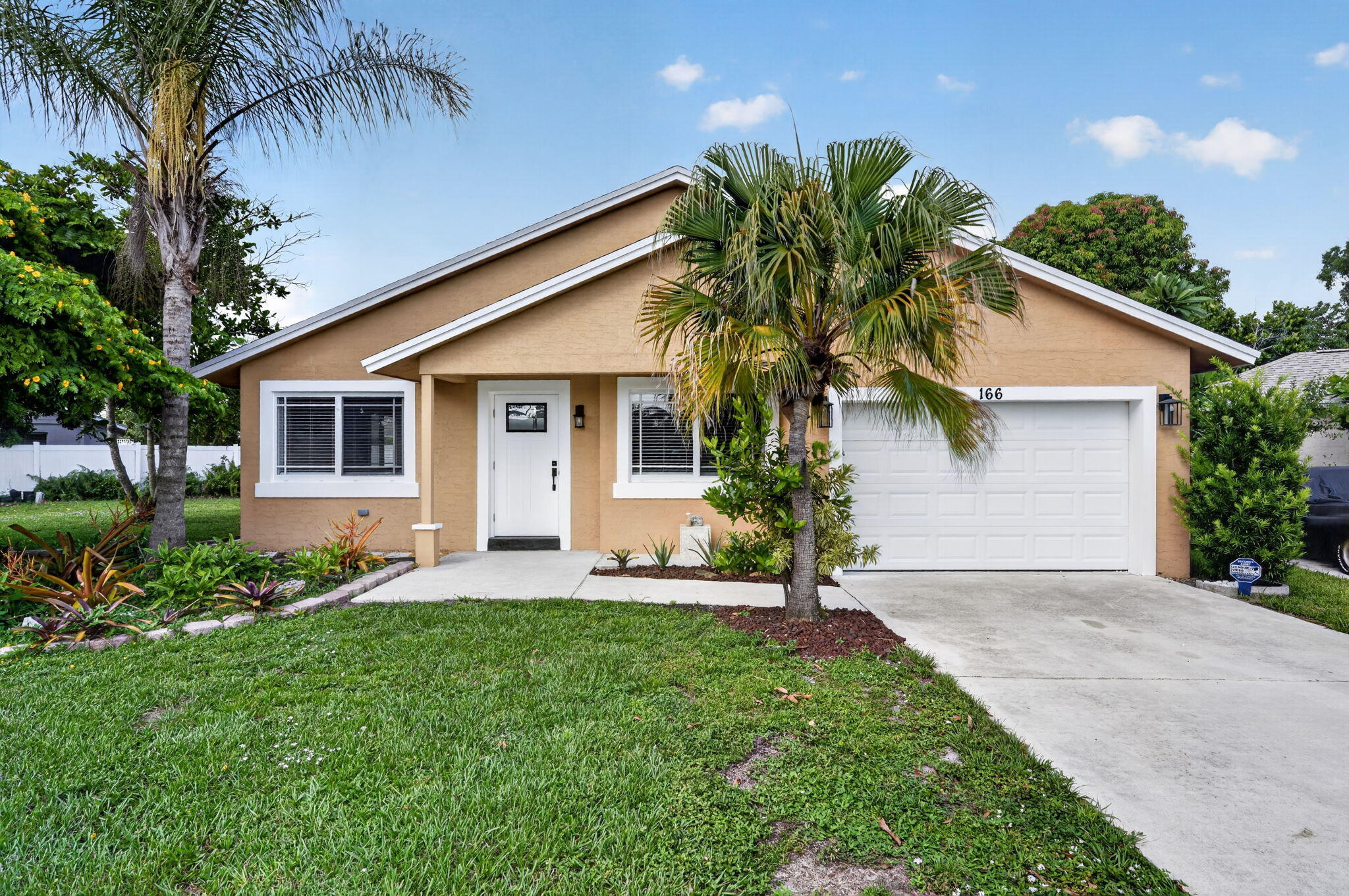 Welcome to this charming 3-bedroom, 2-bathroom CBS home situated on a quiet cul de sac in the desirable Indian Creek community. The property features a spacious lot with room for a future pool, a beautifully paved backyard retreat, full impact windows, and a 4 year old A/C unit.   Inside, you'll find tile and wood flooring throughout and a flexible third bedroom with access to the patio—ideal for a home office, guest space, or den.   Indian Creek offers a community pool and tennis courts with a low HOA of only $255 per year. Conveniently located minutes from Jupiter's beaches, parks, golf, and waterfront dining, this home presents an excellent opportunity to enjoy one of Jupiter's most established neighborhoods.