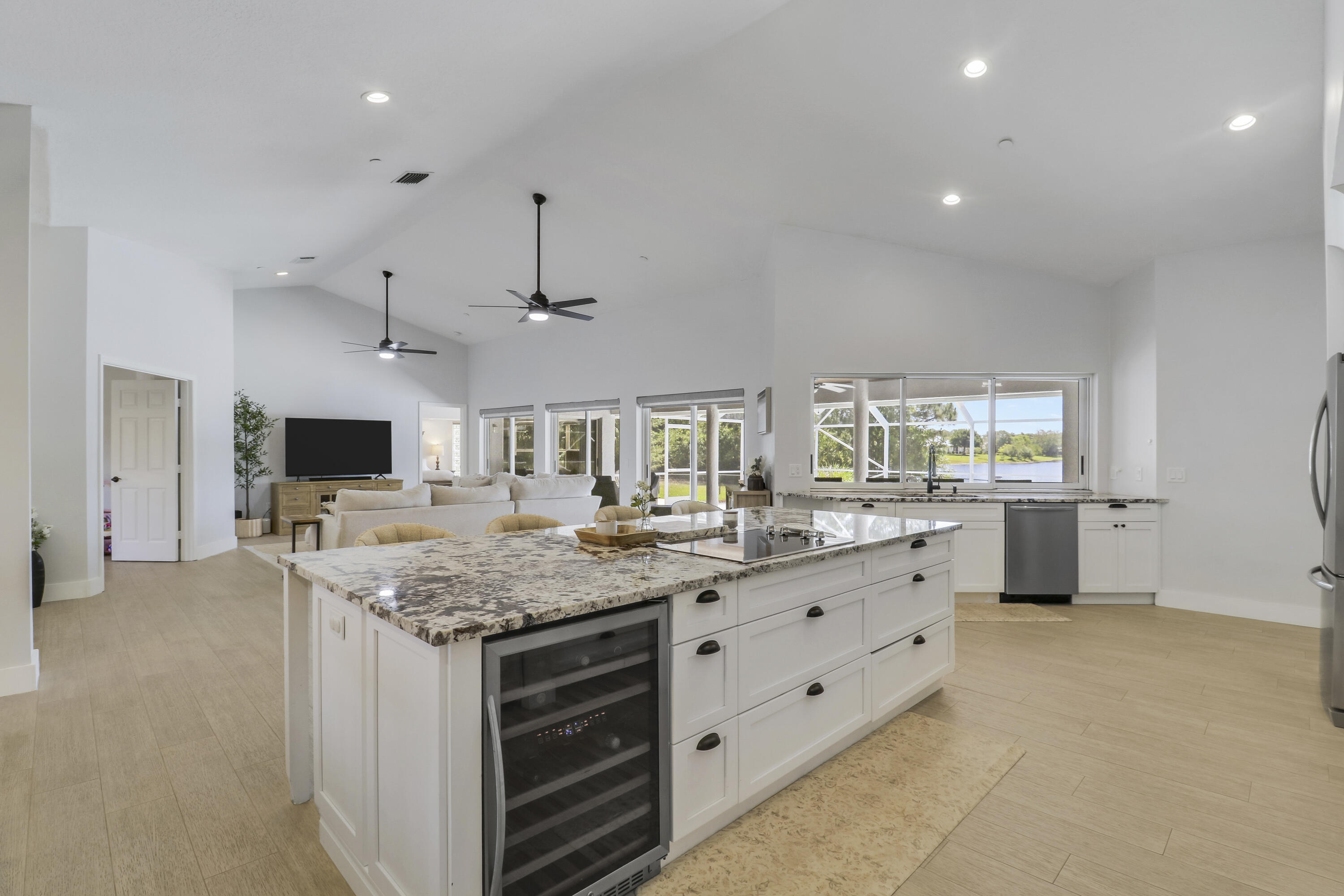 Come see this exceptional 5 bedroom, 3 bath single family CBS home with breathtaking LAKE views in South Fork Estates! Enjoy the luxury of a swimming pool and spa in your own private backyard oasis! The open kitchen boasts granite countertops (with oversized island), soft-close cabinets, and new stainless steel appliances. NEW ROOF installed in 2024! Pool was resurfaced in 2023. Relax in style and privacy with a fully fenced backyard. Your dream home awaits! South Fork Estates is a small HOA community consisting of 121 single family homes - with boat & RV storage, community playground, and canoe & kayak river access. This home is located super close to Halpatiokee Regional Park, the largest park in Martin County - featuring soccer & football fields, tennis courts, pickleball courts, and yo u can bring your own kayak or canoe and explore the South Fork of the St. Lucie River.