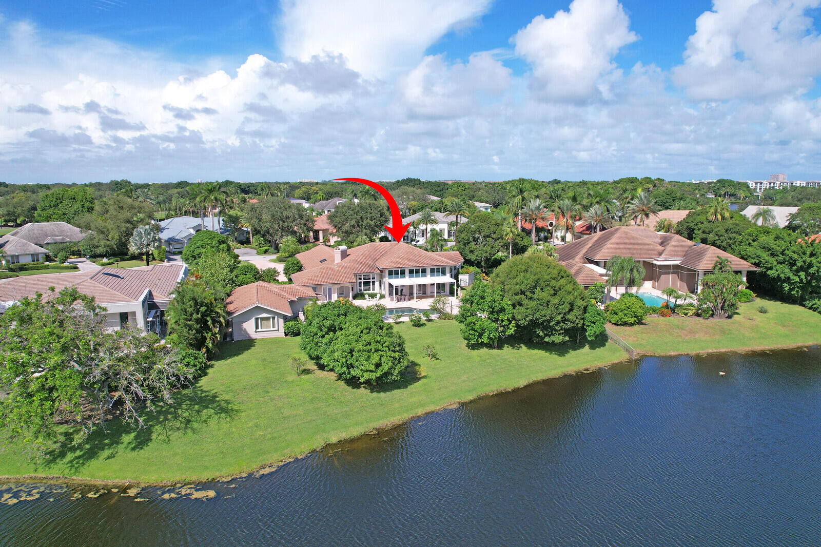 NEARLY ONE ACRE LOT! Breathtaking lakefront beauty is showcased in this spacious, light-filled single story residence in the prestigious community of Frenchman's Creek. Offering 4 bedrooms plus an office and 4.5 bathrooms - including a private and convenient 1/1 casita - this impressive estate spans over 6500 sq ft of living space on an expansive .87 acre lot. 

Designed for both grand entertaining and comfortable everyday living, the thoughtful crafted floor plan features generous living spaces enhanced by tasteful updates throughout. A contemporary kitchen and a striking double-sided fireplace elegantly adorns the main entertaining spaces. Soaring volume ceilings and an entire wall of windows frame exquisite lake views to create perfect Florida indoor/outdoor living. 

The grand prim suite serves as a private retreat, complete with an attached sitting/viewing room, oversized walk-in closets, and a spa-inspired bath. Enjoy serene garden vistas from the separate soaking tub and glass-enclosed shower, adding to the suite's tranquil ambiance.

Step outside to experience remarkable lake vistas beyond the custom pool and spa, complemented by sizeable green space and lush landscaping. Schedule your private showing today!

Frenchman's Creek Members enjoy the ultimate concierge lifestyle with resort amenities, state-of-the-art brand new clubhouse, two 18-hole championship golf courses - for only 600 homes. Numerous dining options, navigable waterways, racquet sports, social events and so much more. The exclusive Beach Club, included with
membership, located on beautiful Juno Beach allows use of pool, restaurant, beach attendant and water activities.