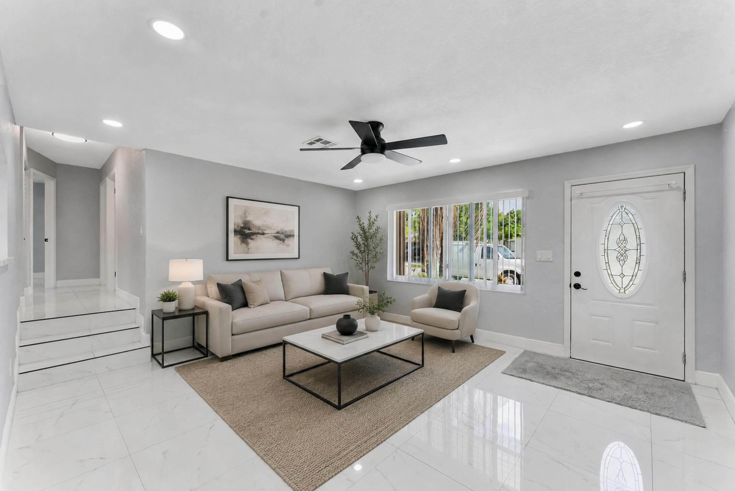 Beautifully updated 3-bedroom, 2-bath single-family home offering modern finishes, a functional layout, and a spacious backyard perfect for everyday living and entertaining. Step inside to a bright, open living area featuring sleek oversized porcelain tile flooring, recessed LED lighting, neutral designer paint, and abundant natural light that creates a fresh and inviting atmosphere.  The remodeled kitchen is designed with both style and functionality in mind, showcasing white shaker cabinetry with contrasting gray lower cabinets, quartz countertops, stainless steel appliances, ample cabinet storage, and generous counter space for meal preparation. A convenient pass-through opening connects the kitchen to the main living area, making it ideal for entertaining family and guests.   The spacious primary suite offers a private retreat with an en-suite bathroom, while two additional bedrooms provide flexibility for family, guests, or a home office. Both bathrooms have been tastefully updated with contemporary finishes and fixtures, completing the home's clean, modern aesthetic.  Outside, enjoy an expansive, fully fenced backyard with plenty of room for children and pets to play, weekend gatherings, gardening, or future additions such as a pool. A storage shed provides extra space for tools, lawn equipment, or seasonal items, while the patio offers the perfect spot for outdoor dining or relaxing.  Conveniently located near shopping, restaurants, schools, parks, major highways, and everyday amenities, this move-in-ready home combines comfort, style, and practicality in one exceptional package. Whether you're a first-time homebuyer, growing family, or investor, this property offers outstanding value and endless possibilities. Don't miss the opportunity to make this beautifully renovated home your own!