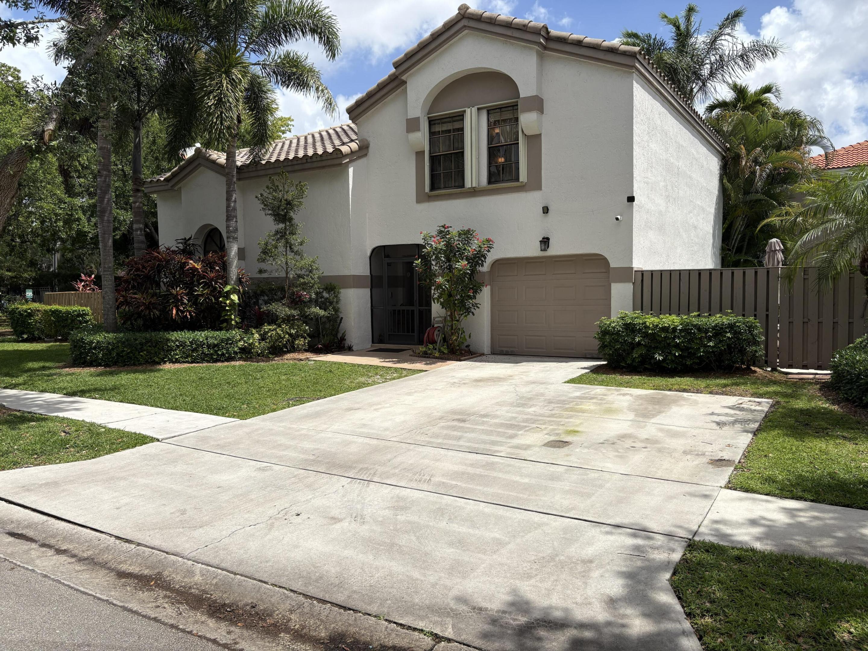 This spacious 2,000 sqft, two-story corner residence offers 4 bedrooms, 2.5 bathrooms, and a versatile layout ideal for comfortable living. The home includes a private backyard, a 1-car garage, and 2 additional parking spaces, providing excellent convenience for residents and guests.  Inside, the second bedroom features a built-in Murphy bed, maximizing space and functionality. The fourth bedroom is currently used as an office, and can be easily enclosed or converted back into a full bedroom if desired.  The association is paid quarterly