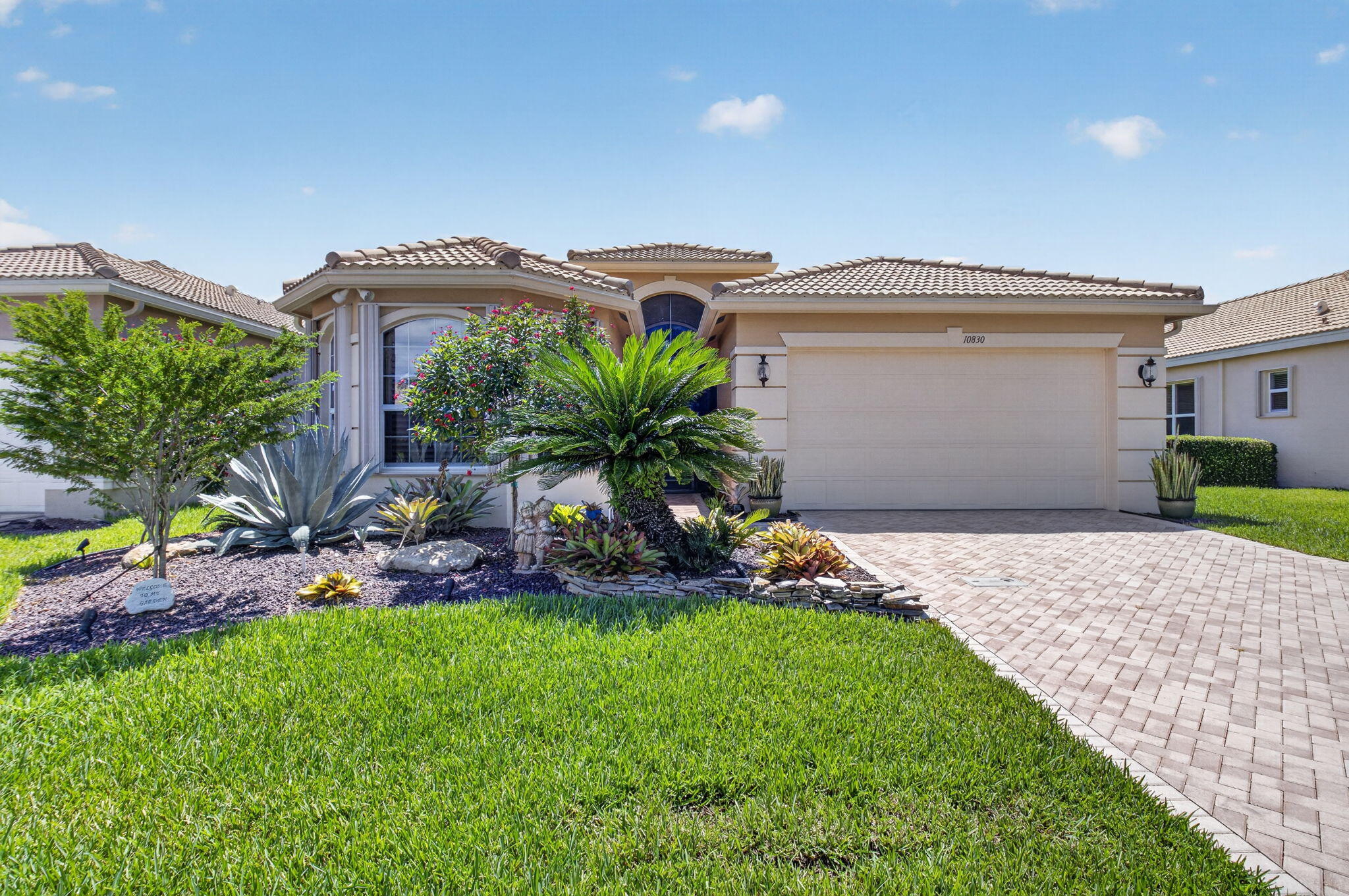 Welcome home to this beautifully maintained, well-cared-for 3-bedroom plus den, 2.5-bath residence situated on a stunning premium lakefront lot in Valencia Reserve, one of Boynton Beach's premier active adult communities. Located along the desirable Lyons Road corridor of luxury communities, this home offers peaceful water views from the screened-in patio, creating the perfect setting for morning coffee or evening relaxation. This thoughtfully upgraded home features accordion shutters, an impact-rated rear patio door, an in-ground generator, neutral custom shades, decorative transom window coverings, plantation shutters in the guest bedroom, and fitted closets in the primary suite. The kitchen is equipped with stainless steel appliances, under-cabinet and above-cabinet lighting, and opens seamlessly to the living areas, making it ideal for both everyday living and entertaining. Additional highlights include an epoxy-coated garage floor, upgraded landscaping, and a spacious laundry room with built-in cabinetry and a utility sink.  Valencia Reserve offers an exceptional resort-style lifestyle with a magnificent newly renovated clubhouse, resort-style pools, a fitness center, tennis and pickleball courts, bocce, card rooms, billiards, social clubs, an on-site café, and a full calendar of activities and events. Experience the perfect combination of comfort, convenience, and active living in this highly sought-after 55+ community.