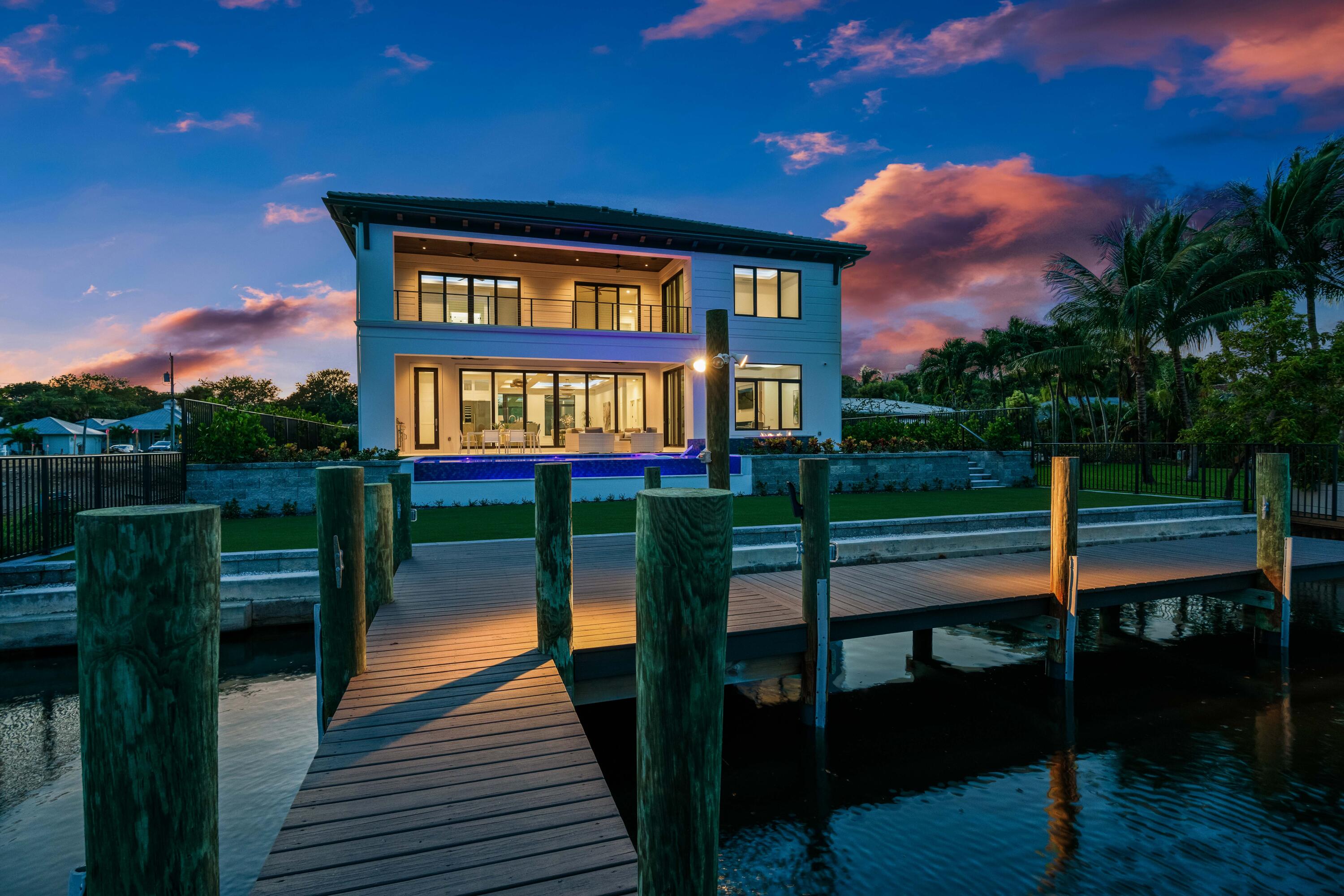 BRAND NEW WATERFRONT HOME by Vista Builders in the coveted neighborhood of Pirates Cove! This thoughtfully constructed private residence checks all the boxes. Sparkling pool with infinity edge with views to the Intracoastal. Boasting 5 spacious bedrooms plus loft, 5.5 baths and a flexible floor plan inside, this home offers a study/second dining space and two generous living areas. Kitchen is a chef's dream with a large pantry and Thermador appliance package including a duel-fuel range. Smart home features include app-controlled automated pool and Sonos sound availability! Impact glass throughout, 1000 gallon propane tank, tankless water heaters, temperature controlled garage. Contract price $6,650,000. Buyer paid Seller's closing costs for final sale price of $6,318,662.50.