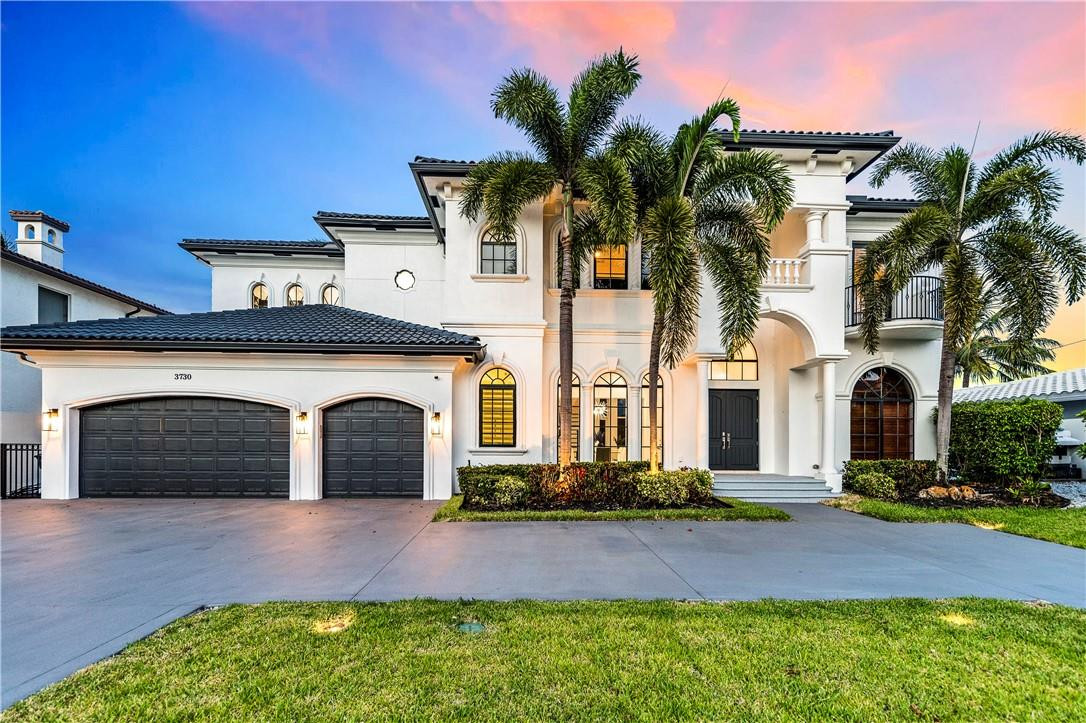 Absolutely spectacular waterfront mansion in Lighthouse Point. The pool sits directly on 90ft of waterfront w/ ocean access, NO FIXED BRIDGES, and a gazebo. Inside and out you won't find an inch that has not been fully remodeled. The ultra-sleek 4 bed, 4.5 bath home consists of open spaces, large impact windows that allow tons of natural light, neutral floors and walls accentuated by dark wood tones, an iron rod staircase, high ceilings, and water views from almost every room. An elevator will take you from the spacious first story into the master suite upstairs. Spacious kitchen with top-of-the-line appliances, and a large office in addition to the rooms. Excellent location minutes from the ocean, airport, downtown Ft. Lauderdale, and much more!