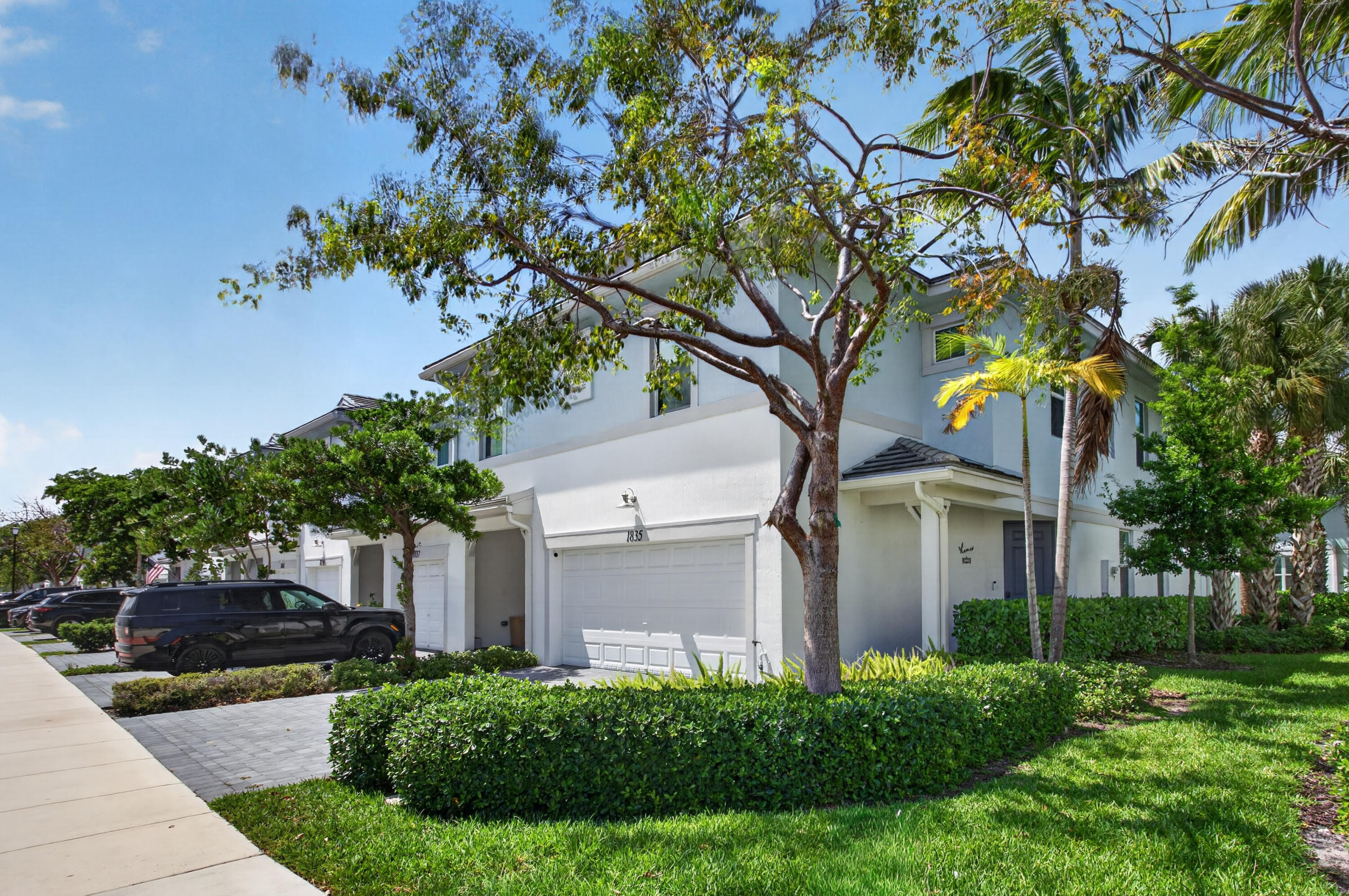 Beautifully upgraded 4BR / 2.5BA corner unit featuring an open-concept layout filled with natural light. Highlights include custom built-in closets, walk-in master closet, LED lighting throughout, crystal fixtures, and a spa-like oversized walk-in shower. Spacious second-floor loft and large laundry room conveniently located near all bedrooms. Additional upgrades include an epoxy-finished garage, whole-home water filtration system, and security system with cameras. Enjoy a rare private 550 SF fenced outdoor space with porcelain pavers, perfect for entertaining or relaxing. Located on a quiet street, just a short walk to the pool, gym, and mailroom. Should see, to appreciate it!!!