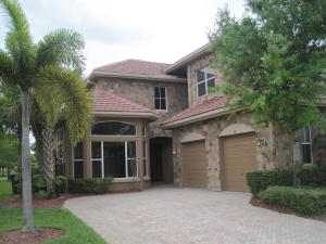 Upgraded estate home with lake views!  3 bedrooms + office space + loft area!  Soaring ceilings and open double-story iron staircase greet as you enter this beautiful home.  Open, granite kitchen with wall ovens and gas cooktop.  Master bedroom + office space is located on the 1st floor.  Upstairs there is a generous loft area open to below and very large bedrooms with bathrooms en suite and huge walk-in closets.  Enjoy the lake views from the private, fenced in lot.  A must see!