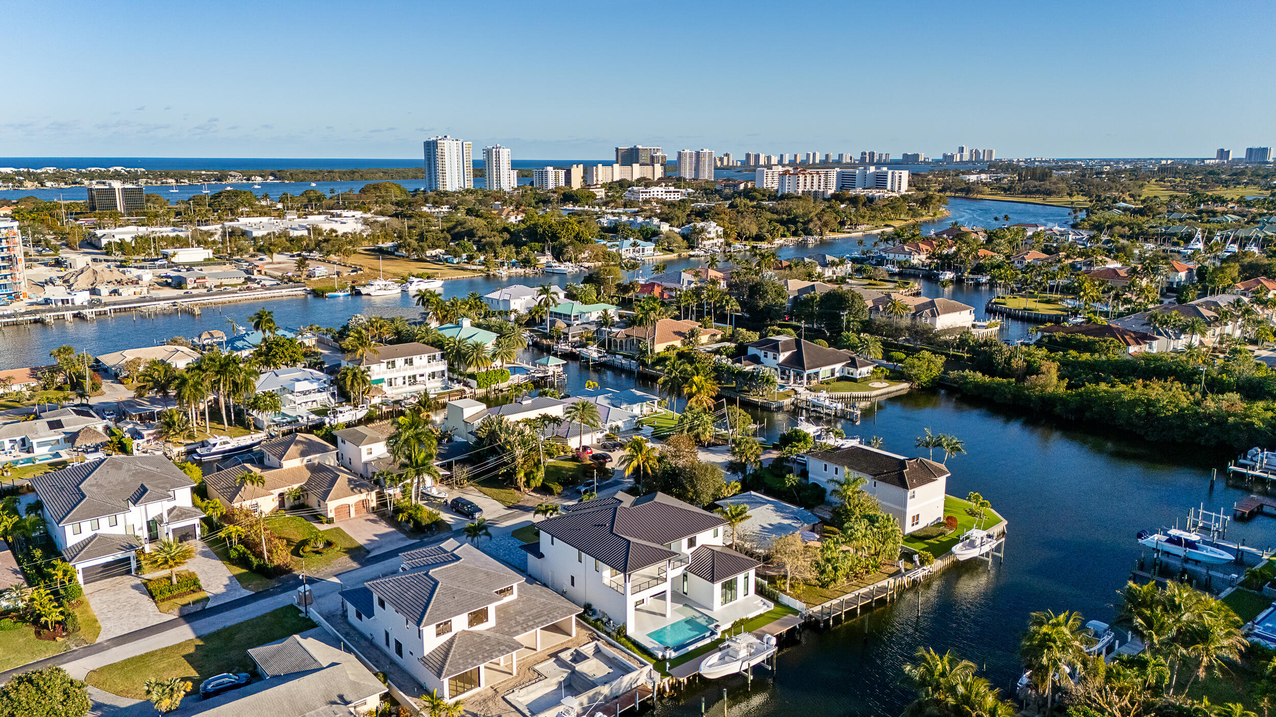 Brand new waterfront construction in the heart of Palm Beach Gardens offering the perfect blend of luxury and functionality. Designed with a thoughtful, open layout, this residence features 5 en-suite bedrooms, a private office, loft, elevator, and dual laundry rooms for ultimate convenience. Enjoy true boating lifestyle with direct Intracoastal access with no fixed bridges, dockage for up to a 60' yacht, and quick access to the Palm Beach Inlet. Quality craftsmanship shines through with premium finishes throughout. A collector-ready 3-car garage with lift capability accommodates up to 6 vehicles. Rare county-only property taxes! Just minutes from world-class dining, golf, shopping, and beaches; this is South Florida waterfront living at its finest.