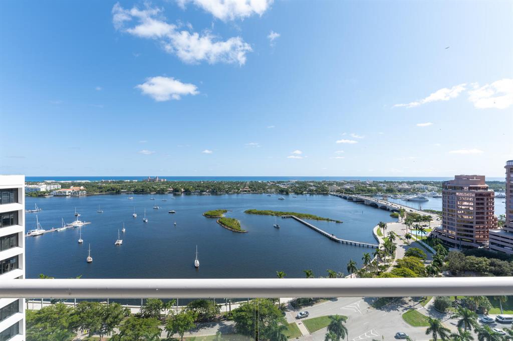 Stunning double unit. Beautifully renovated. No expense spared. Over 4,000 total sq.ft. Three bedrooms, 4 full bathrooms and one half bath. Den. Sweeping views of the Ocean, Intracoastal Waterway, and the Island of Palm Beach. Grand living area. Italian porcelain tile throughout, Miele appliances, custom cabinets, built-in dry bar, custom work station, hurricane impact doors and windows, Sonos sound system, electric blinds, and ample storage space throughout. North, East and West exposures. Outdoor balcony offers exceptional living/dining space and water views. Full service, luxury building with 24-hour security, valet parking, concierge, two swimming pools, fitness room, conference room, and tennis court with pickleball. Pet friendly. Easy distance to all that the area has to offer: shops, restaurants, CityPlace, Kravis Center and Norton Museum of Art, ocean beaches and Palm Beach nightlife. Call today to preview this move-in ready residence. No expense spared. A must see.