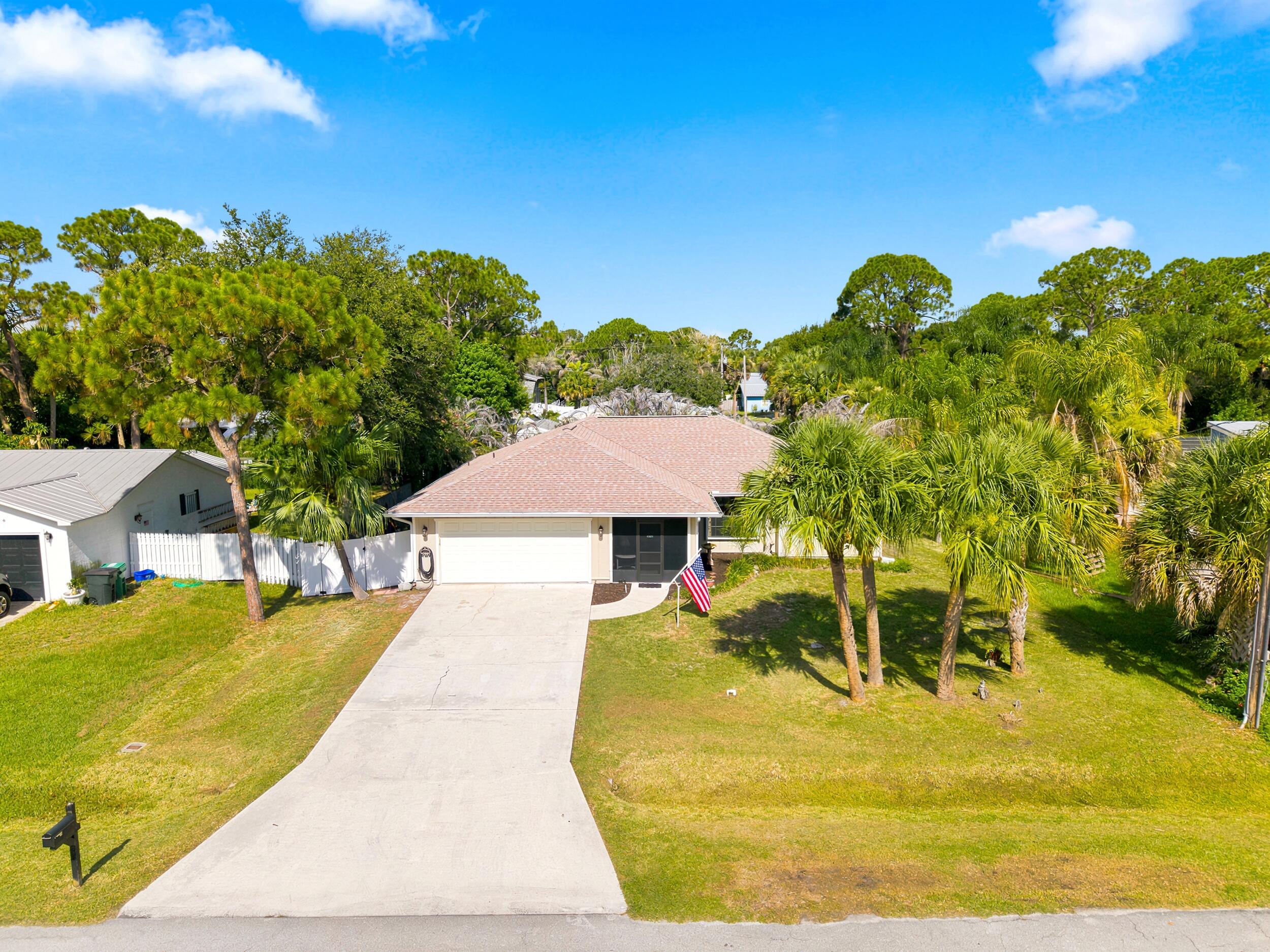 A BUYER'S DREAM  /  BEAUTIFUL PEACEFUL NEIGHBORHOOD.... Come check out this Awesome 3/2/2 Split plan not far from the Intracoastal, Beaches, and the Savannah's with plenty of Nature Trails. This home has over 1650 ft. under air, with a large Back Screened Porch, and enclosed Front Screen Porch, all with high quality Suntex screen. Home features a 3yr. Roof, Complete Storm Protection, with Newer Accordian Shutters on all windows, New Masterbath remodel, Full yard Irrigation System, with Brand New Well Pump. New Water Heater. Surround Sound system in Living Room, Built in storage cabinets in Garage, Fully Fenced in yard for pets, Room for Pool, and much more....Call for your private showing & CHECK THIS ONE OUT TODAY!!!
