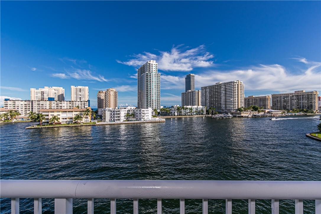BRING YOURS FUSSIEST BUYERS! Impeccable 4th Flr. corner remodeled WITH PERMITS, sold FURNISHED, TURNKEY! Sellers spare no expense, upon entering this gorgeous condo you'll notice the seller attention to detail at every glance. Get that ''CRUISING '' feeling & watch the boat go by on the Intercoastal. The kitchen and baths have been extensively remodeled with the latest trends & style in 2013. Coffered, stretch ceiling with recessed lighting that will leave you breathless day & night! Open gourmet kitchen with huge island perfect for entertaining. Wine cooler. 16 x 32 porcelain tile. Electric blinds. Central Vacuum. New A/C, W/H, electric panel. Impact windows/doors. Washer inside unit. 40 yrs. done. Well maintained bldg. Amenities: pool, gym, BBQ, billiard, recreation rm. 1 MI. from beach.