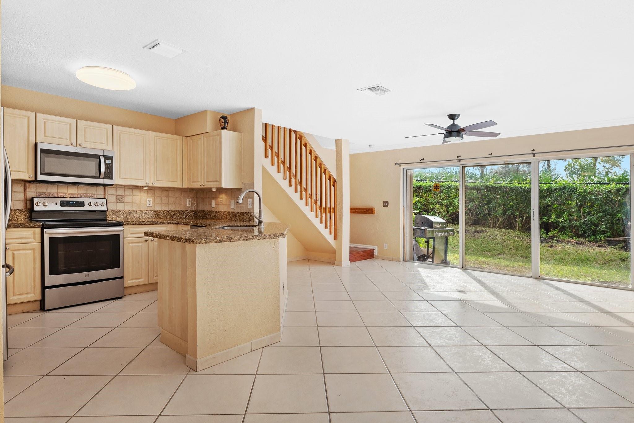 PRICED TO SELL! Fee Simple Townhome with Garage-You own the land front & rear: .38 acres or 1657 SF*ACCORDION SHUTTERS on ALL WINDOWS*Security system*Updated Kitchen has Granite Counters*SS Appliances & sink: 2022 Whirlpool Micro+2022 Bosch DW+2019 Samsung Fr Dr Frig+2019 GE Range*Pantry*Tile Backsplash w/Undercounter lights*Tile floors 1st floor & Wood laminate stairs & 2nd floor*Paver Patio with BBQ included*Laundry in Garage & Extra Frig included*Auto Garage Door Opener*2019 Hot Water Heater*2016 HVAC*Low HOA $280/month*Min FICO 675*