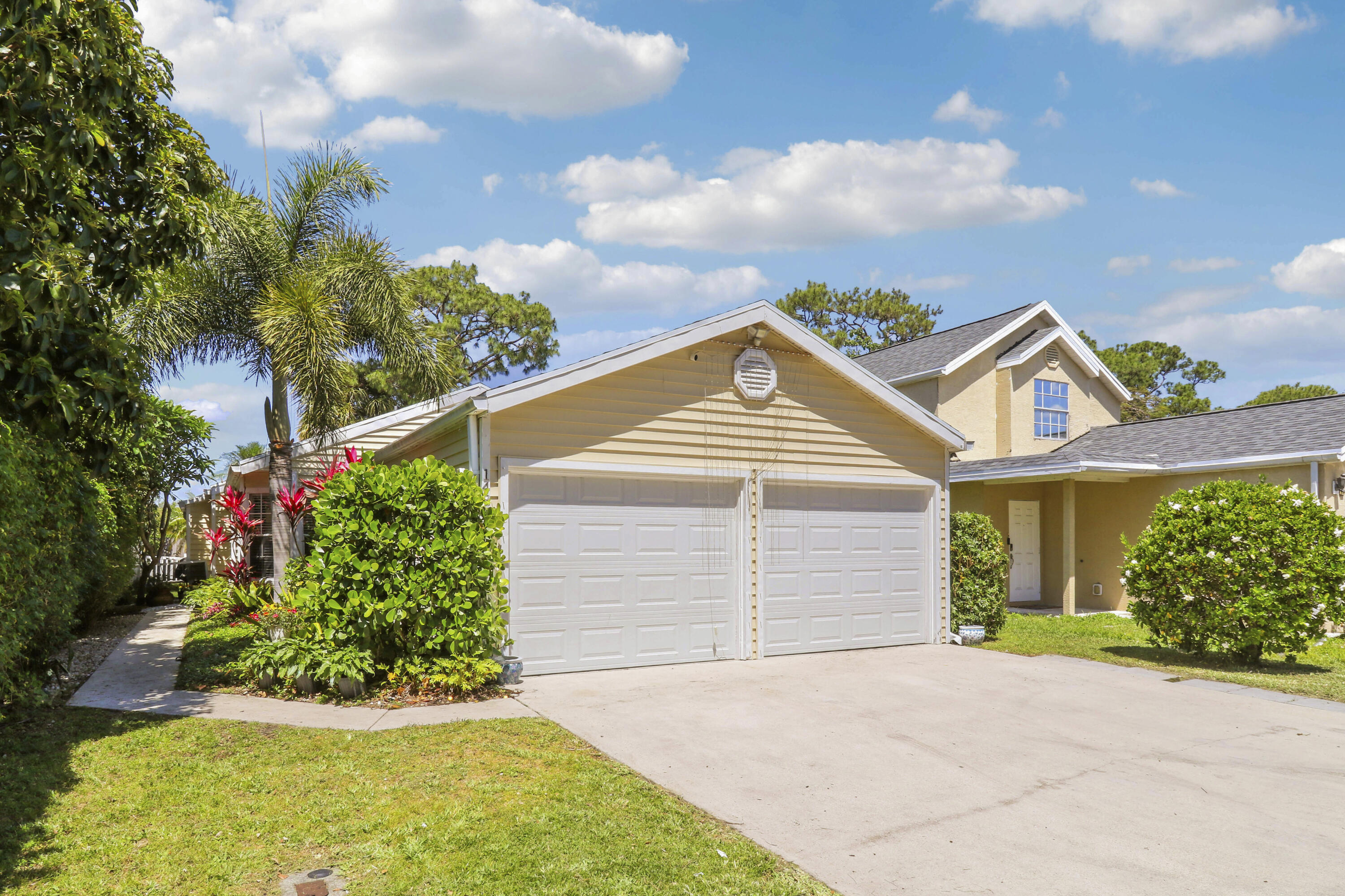 Welcome to this beautifully updated single-family home located in Victoria Woods, a gated community in West Palm Beach with an incredibly low HOA offering the perfect combination of value, comfort, and lifestyle.  This 2-bedroom, 2-bathroom home with a spacious 2-car garage is ideally positioned at the end of a quiet street, providing added privacy and minimal traffic. Inside, you'll find a light-filled layout with tile flooring throughout the main living areas and laminate wood flooring in the bedrooms  for a warm, cohesive feel.   The open kitchen and updated bathrooms give the home a modern touch, while French doors from both the living room and primary suite lead out to your private patio and yard perfect for relaxing or entertaining.  BRAND NEW ROOF installed in April 2026 offers peace of mind for years to come. Residents enjoy access to a wide range of community amenities including a pool, pavilion with BBQ grills, tennis courts, basketball, racquetball, a tot lot, baseball field, and sand volleyball all within a secure, gated setting.  If you're looking for a move-in ready home with updates, privacy, and low-maintenance living in West Palm Beach, this is one you don't want to miss.  Buyer may qualify for a complimentary 1/0 rate buydown through June 30th when using preferred lender.