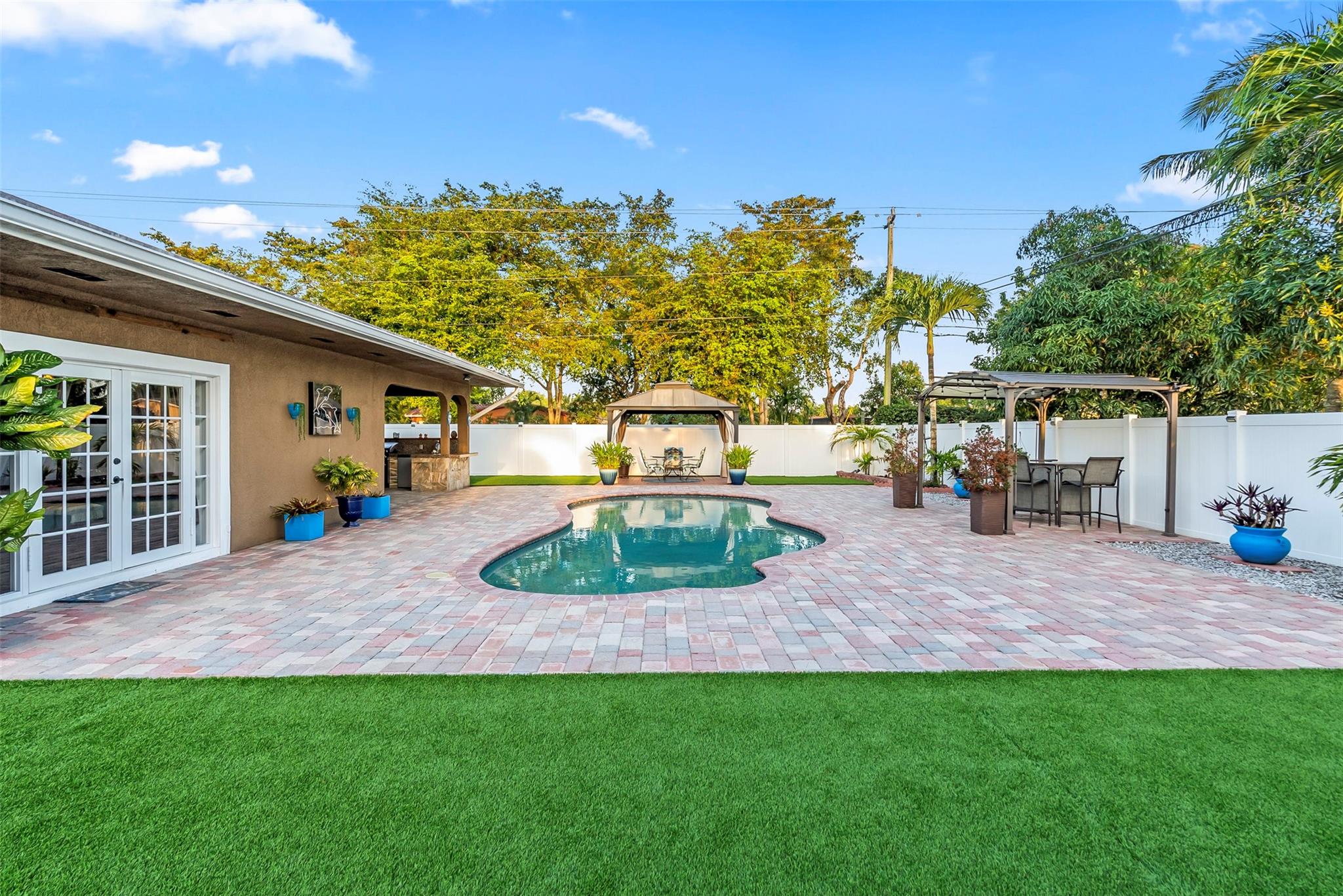 This immaculate, move in ready 3 bedroom, 2 bathroom pool home in Plantation sits on a fenced in, oversized corner lot. This open floor plan offers plenty of options to make this well maintained home your own. Out back, enjoy the perfect pool space for entertaining OR relaxing with a huge deck area, gazebo AND covered patio with built in outdoor kitchen space. The recently installed synthetic grass & newly installed pool equipment ensures your outdoor maintenance is simple. Water Heater 2024, Cast Iron Lining 2021, Turf 2022, Pool Equipment 2023, Roof 2019. $600k FHA Available at request - Previous buyer could not secure financing after inspection & appraisal were complete!