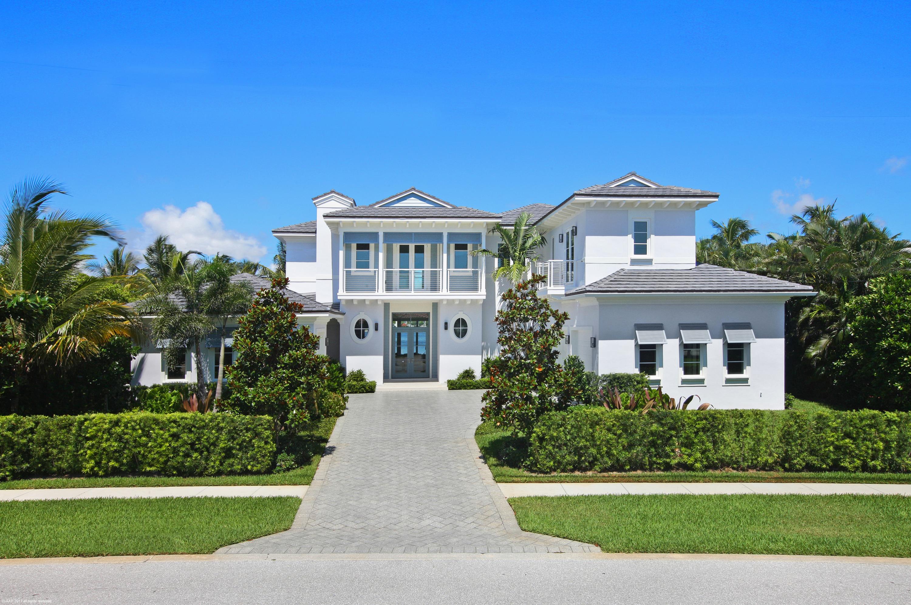If a magnificent lifestyle on the quiet, secluded and secure island of Point Manalapan, with spectacular views and access to both the Intracoastal Waterway and the Ocean is your idea of perfection – this luxury home is for you.  Quietly nestled along the eastern shore of one of south Florida’s fastest growing areas is the small, luxury community of Manalapan. This recently completed 7,000 sq. ft. custom estate contemporary home has 5-bedrooms, 6 full baths & 2 half bathrooms. Its open floor plan was designed for comfort and entertaining. Upscale features throughout the home include solid maple cabinetry with Restoration Hardware knobs and pulls and white Crema Marfil marble floors. The main floor flows seamlessly between the large living, family and great rooms, all with spectacular natural lighting and fabulous waterfront views. The formal dining room is perfect for quiet, elegant dining, and the coffered and vaulted ceilings on the main floor, all with recessed lighting, subtly add to the spacious feeling. The large custom designed kitchen with it casual dining area, also features a large center island breakfast bar & prep area. For the gourmet cook, there is a hooded gas range, built-in appliances, carrara marble counter tops, custom wood cabinetry with fantastic storage capability all bathed in natural lighting.  

A uniquely designed stairway leads to the second floor with vaulted ceilings.  The  king size master BR opens onto a large covered balcony overlooking the beautiful Intracoastal waterway and features exceptional closet and storage space as well as a master bath with Calacatta Gold marble floors and shower surrounds.

For entertaining there is a large outdoor covered and open patio, a pool with spa and spill-over waterfall, as well as views of the water and lush landscaping that surrounds the home.

This estate home with its attached 3-car garage offers some incredible amenities including: free membership to the "La Coquille Club" located at the Eau Palm Beach Resort & Spa, rated the #1 Resort in Florida by Conde Naste Traveler. The club features a state-of-the-art spa and fitness center, tennis courts, and pool and beach facilities.