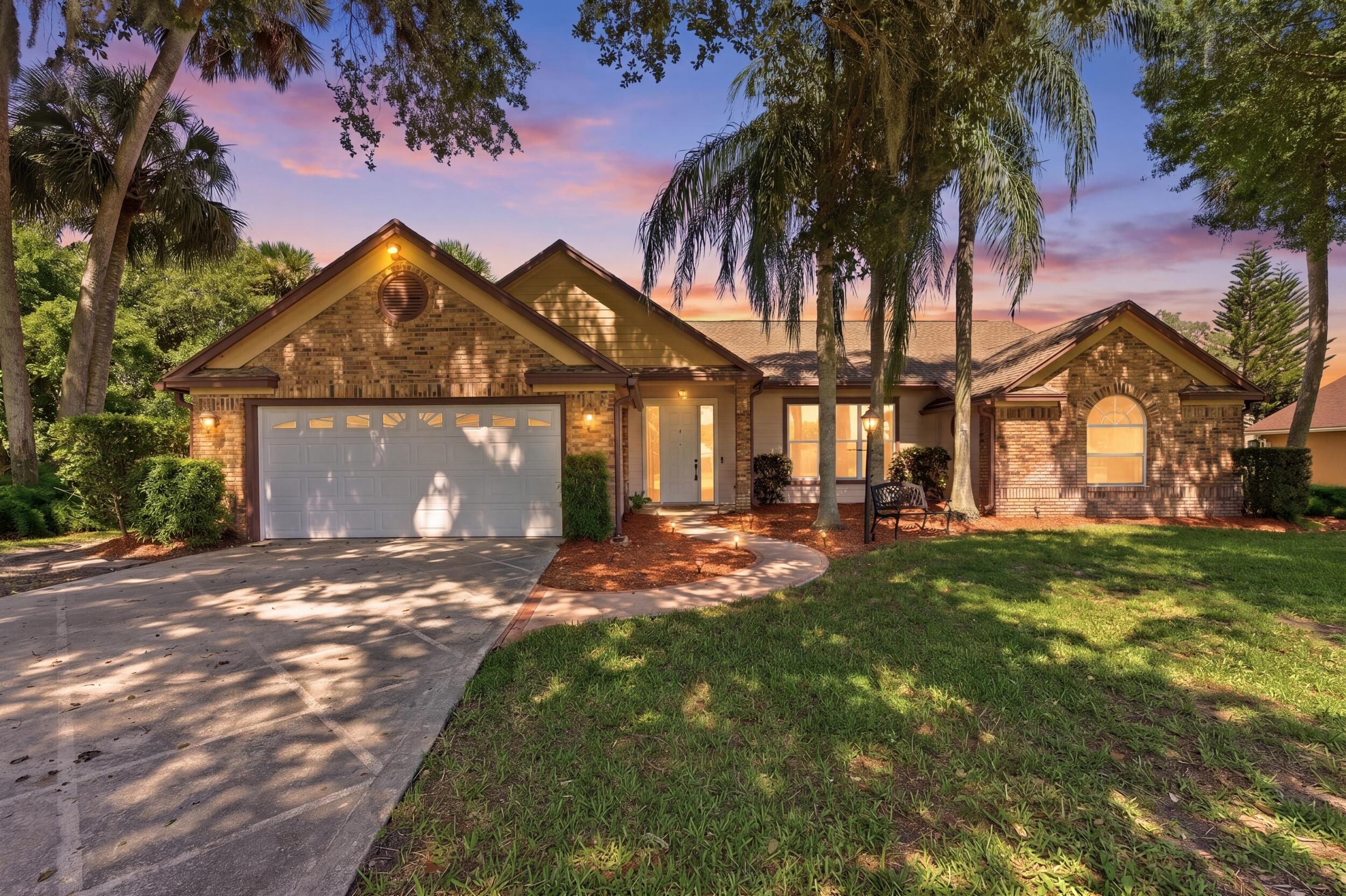 Tucked away in a quiet and charming neighborhood in Okeechobee, this spacious home at 1960 SE 9th Ave offers peaceful living on a beautiful half-acre lot with preserve views to the side and rear for added privacy. Featuring a desirable split floorplan, oversized 2-car garage plus a golf cart garage/workshop space, and a massive mature oak tree welcoming you home. Enjoy mornings on the back porch built for coffee, BBQs, and bird watching. Conveniently located near shopping, restaurants, and easy access to Hwy 70 & 710. Plus, just minutes to Lake Okeechobee for world-class fishing and boating. Brand-new water heater, extra garage fridge included! Located in the heart of Okeechobee, this property offers the perfect balance of peaceful small-town living and outdoor adventure. Known as the gateway to Lake Okeechobee — one of the largest freshwater lakes in the country — the area is famous for world-class bass fishing, boating, kayaking, and breathtaking waterfront sunsets. Outdoor enthusiasts also enjoy nearby parks, nature trails, hunting land, camping, and equestrian properties throughout the surrounding countryside.  The home is conveniently located near local shopping, restaurants, medical facilities, schools, and everyday conveniences while still maintaining the privacy and quiet charm that makes Okeechobee so desirable. Easy access to Highway 70 and 710 allows for convenient travel to the Treasure Coast, West Palm Beach, and Central Florida.  Residents love the relaxed lifestyle, larger lot sizes, mature oak trees, and sense of community that define the area. Whether you enjoy fishing tournaments, rodeos, local festivals, waterfront dining, or simply watching wildlife from your backyard, Okeechobee offers authentic Florida living with room to breathe.