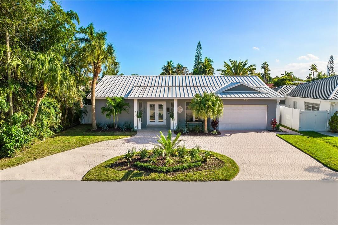 Beautifully Remodeled 4/2 Waterfront Home in East Fort Lauderdale, with Good Looking Curb Appeal! Great Water Views and a Lovely Formal Dining Area. Kitchen Offers a Pass-Thru to Pool Area, and a Convenient Bar for Casual Dining. Southern Water View Lounging Area With Brand New Gorgeous Turf Feels Like a Resort. Beautiful Dock Plenty of Room to Enjoy Outdoor Living. Enclosed Large Pool, w/ Generous Sitting Areas for Your Personal Enjoyment! Metal Roof, Newer Appliances and Flooring. 2-Car Over-sized Garage w/ Epoxy Flooring. Keep Your Boat Out Back for Quick Getaways! Don't Miss This Grand Opportunity! Just Minutes from ALL that Fort Lauderdale has to Offer! This Property is Professionally Staged From Top to Bottom for an Exceptional Showing Experience. Don't Wait ...See it Today!