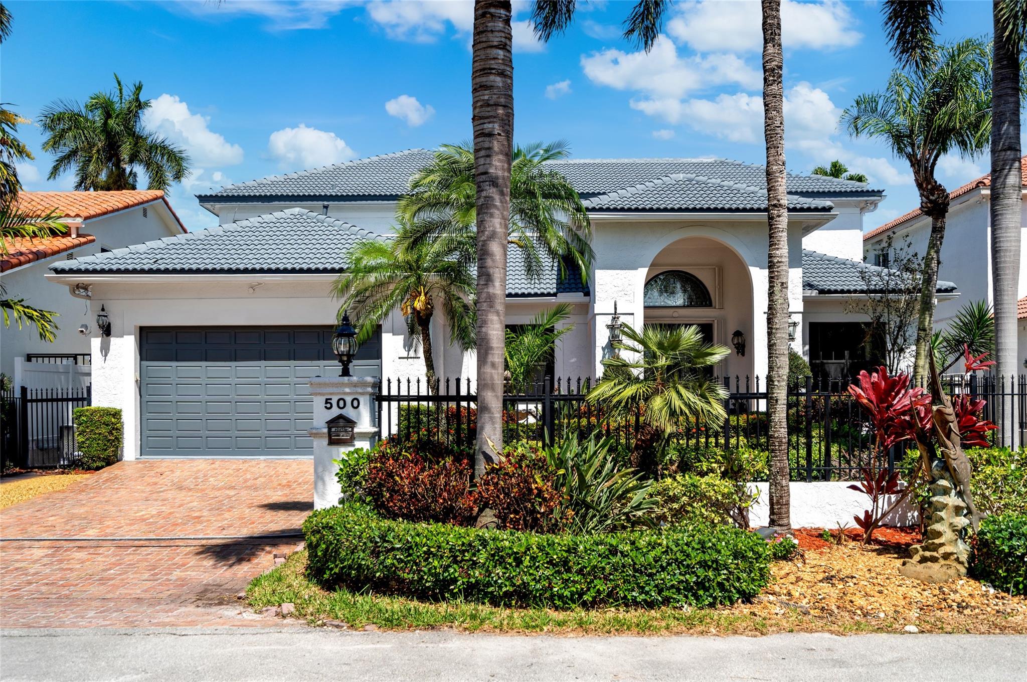 Sited on 70 ft +/- of Deepwater Dockage on the South side of Las Olas, offering quick access to Port Everglades by boat, this reimagined 5 Bedroom, 3 Full Bathroom, 1 Half Bathroom Coastal Residence boasts over 4,050 sqft of living space, with soaring ceilings, an open floor plan, and direct water views from every major room. Designed for entertaining, a grand living room leads to the open kitchen and waterside family room. French doors open to a large pool, jacuzzi, tiki bar/grill and new composite dock. Upstairs is dedicated to the owners suite, offering a huge bedroom with vaulted ceilings, nicely appointed master bath, a bonus loft or office, and a covered terrace with beautiful views down the canal. Other features include a cabana bath and a 2 car garage.