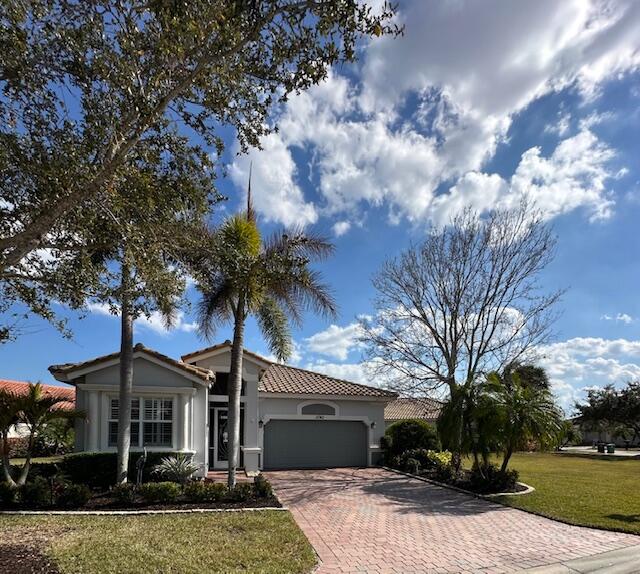 Vitalia at Tradition - Gated 55+ Lakefront Living Beautifully maintained 2BR/2BA home with spacious den in the highly desirable active adult community.  Enjoy tranquil lake views and lush landscaped gardens from the extended lanai, enhanced by volume ceilings, tray ceilings, and a wall of sliding glass doors that fill the home with natural light. The eat-in kitchen features granite countertops, bar seating, and a generous dining area ideal for entertaining. Situated on an oversized pie-shaped lot for exceptional privacy, this home offers comfort, elegance, and resort-style living. Vitalia offers great amenities and events.  located near I95, shopping and trending restaurant minutes away.  A must see! Seller disclosure and Budget 2026 in Documents