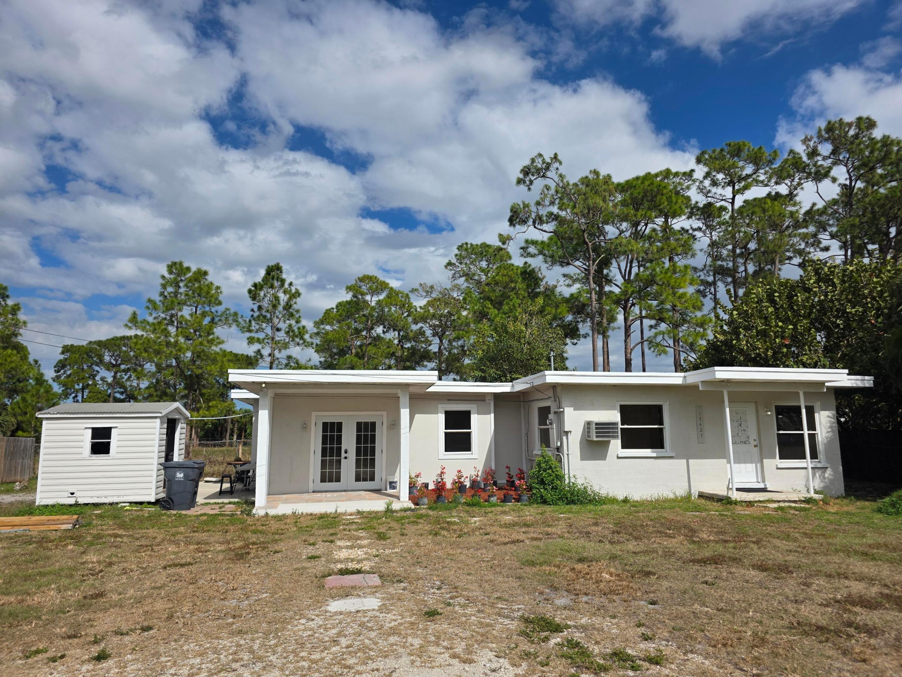 Great opportunity to own a 3-bedroom, 2-bath concrete block home with no HOA! This home features a newly renovated kitchen and bathrooms, along with updated flooring throughout.  Situated on over a quarter-acre lot, the property offers excellent privacy and outdoor space--perfect for relaxing, entertaining, or future expansion. Conveniently located near major roads, shopping, and dining, this home combines comfort and accessibility.  A great buy in today's market--don't miss this move-in ready opportunity!  New AC splits to be installed prior to closing.