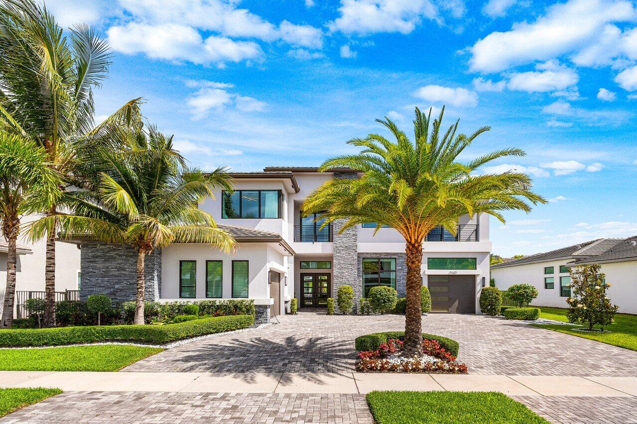 Located in the prestigious Boca Bridges community, this stunning Veneto model offers contemporary luxury with custom high-end finishes throughout. The spacious open layout features soaring ceilings, walls of glass, and seamless indoor-outdoor living. A beautifully designed primary suite, generous guest bedrooms, and refined architectural details create a true sense of comfort and elegance. Outside, the Aurora white marble deck and pool area provide the perfect setting for relaxing or entertaining. Residents enjoy world-class amenities, including a 27,000 sq. ft. clubhouse, resort-style pool, fitness center, tennis and pickleball courts, indoor basketball, and a full-service restaurant/bar.  Full upgrade list available upon request.
