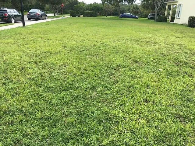 Welcome to 2383 SE Ruskin Drive, a rare vacant lot opportunity in the highly sought after East Lake Village HOA community in Port St. Lucie - where your vision meets exceptional value.  With a $20,000 price improvement, this is your chance to secure the perfect foundation for the home you've always imagined. This blank canvas invites you to design and build a home tailored to your lifestyle--whether you envision a modern retreat, a family haven, or a seasonal escape. Set within a beautifully maintained neighborhood, you'll enjoy a sense of community, pride of ownership, and the convenience of nearby shopping, dining, schools, healthcare, and easy access to major roadways.  Opportunities like this don't come often! Secure your lot, shape your future, and start building the lifestyle you deserve at 2383 SE Ruskin Drive.