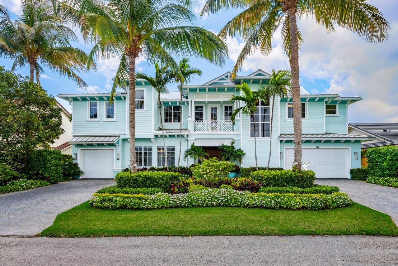 **Exquisite British West Indies/Key West-Inspired Waterfront Estate in Tropic Isle, Delray Beach** Welcome to this truly one-of-a-kind residence offering the perfect blend of luxury, functionality, and coastal charm. Situated just four homes off the point in the coveted waterfront community of Tropic Isle, this expansive 6,000 sq ft estate features 5 spacious bedrooms plus a versatile media room (easily convertible to a 6th bedroom), 6.5 baths, and a 3-car garage. Enjoy serene very wide canal views from nearly every room, with a custom-designed pool and spa as your private outdoor oasis. Boaters will appreciate the two boat lifts, concrete dock, and 90 feet of seawall—an ideal setup for the marine enthusiast. Inside, this Key West-style home—built in 2012—MORE delivers timeless elegance and thoughtful design. Highlights include 8-foot solid core panel interior doors, a 5'x5' state-of-the-art elevator, a central vacuum system, and a comprehensive security system. For added convenience, the home includes a large upstairs laundry room, as well as a washer and dryer on the main level. The heart of the home is the gourmet kitchen, featuring custom cabinetry, premium Thermador appliances, and a well-appointed butler's pantry with sink,  perfect for entertaining and a generator for peace of mind. The loft area upstairs, complete with a beverage fridge and built-in storage, offers a casual gathering space with access to a breezy balcony overlooking the water. Each bedroom boasts its own private en-suite bath, offering comfort and privacy for family and guests alike. The media room is a cozy retreat for movie nights, or can easily serve as an additional bedroom if desired. The home's exterior exudes curb appeal with its standing seam metal roof, custom-crafted gable end details, covered balconies and lanai, and lush tropical landscaping. Interior features like Key West-inspired wall and ceiling finishes, and a handcrafted wood staircase with custom wood handrail, elevate the home's unique character and warmth. A true gem in one of Delray Beach's premier waterfront neighborhoods this home must be seen to be fully appreciated.
