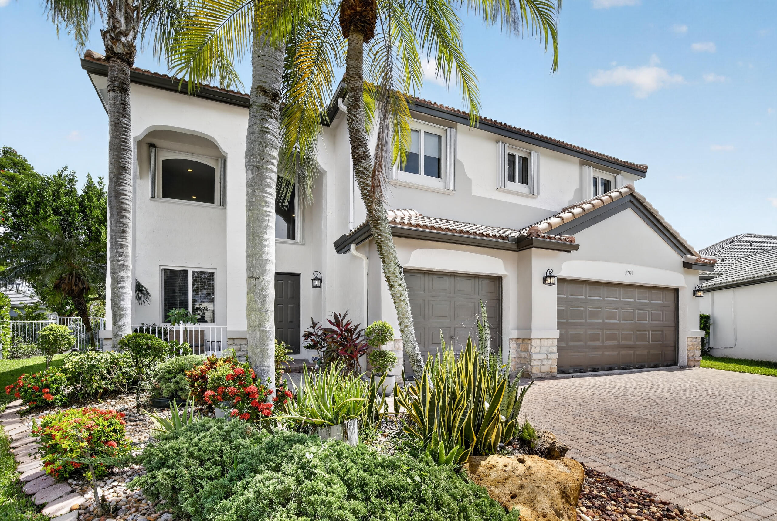 Exceptional 5BR/4BA home in the sought-after Falcon Ridge neighborhood of The Ridges in Weston! This beautifully updated two-story residence offers 3,336 sq. ft. with white porcelain flooring on the first floor, LVP flooring upstairs, fresh interior and exterior paint, a striking wrought-iron staircase, impact windows throughout, and a spacious primary suite with a sitting room ideal for a home office. Enjoy a renovated kitchen and bathrooms, newly resurfaced pool, expansive pool deck, private backyard, and 3-car garage. Pool and lawn maintenance are included. The Ridges offers 24-hour guarded security, a clubhouse, resort-style pool, walking trails, sports courts, and is within walking distance to Weston's top-rated schools and library.