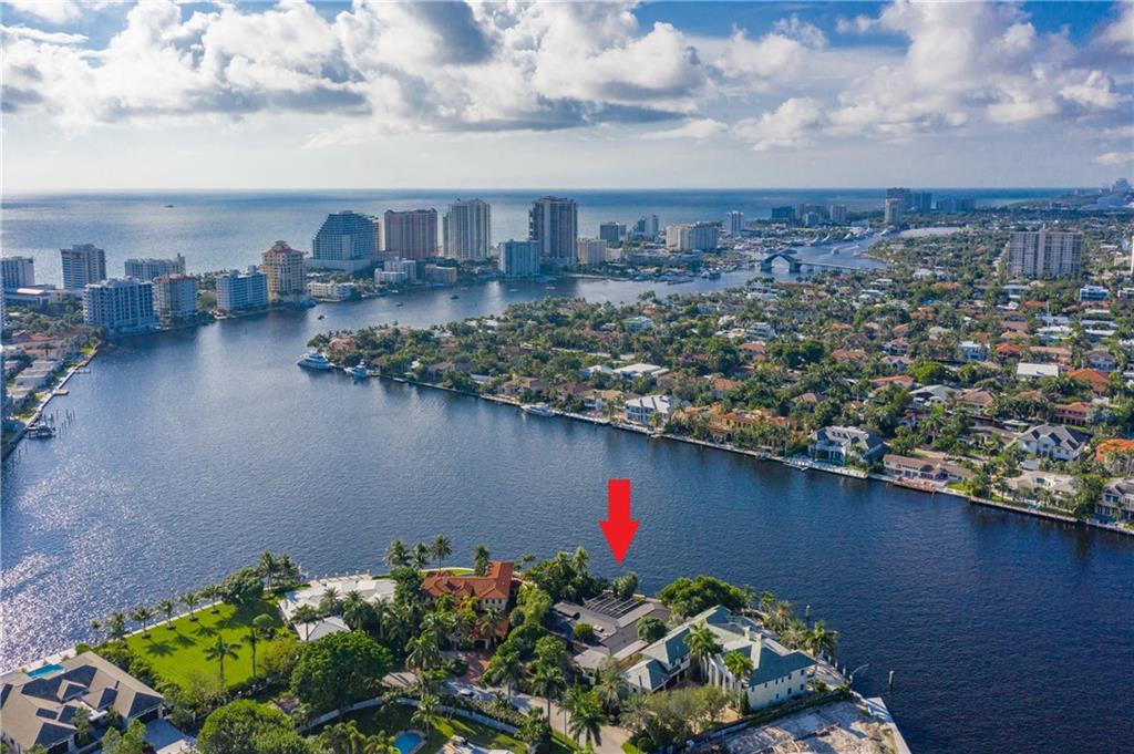 VIEWS, VIEWS, VIEWS! Amazing opportunity in the gated community of Sunrise Intracoastal! Enjoy stunning panoramic views of the Intracoastal, Rio Barcelona & Middle River w/150' of water frontage that can accommodate up to a 130' yacht or multiple boats. Situated on an over-sized lot with approximately .46 acres. Opportunity to renovate or build the home of your dreams. Home features include beautiful cedar wood cathedral ceilings, copper roof, slate and wood floors, sauna, family room, study/media room, natural gas, pool and basement which could be staff quarters. Master bedroom with sitting area/office, dual closets and his and hers bathrooms. The Sunrise Intracoastal community is security patrolled & is walking distance to shopping, dining and the beach!