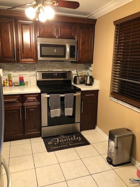 Reserves fully funded. 40 year inspection completed with no issues. Not FHA Approved. VA ok. Kitchen and baths upgraded. Enclosed patio with washer dryer. Ceramic floors, laminate in bedroom. Maintenance includes, internet, cable, water, gym, security gate, clubhouse, pool, tennis, sauna. No rental for the first two years.