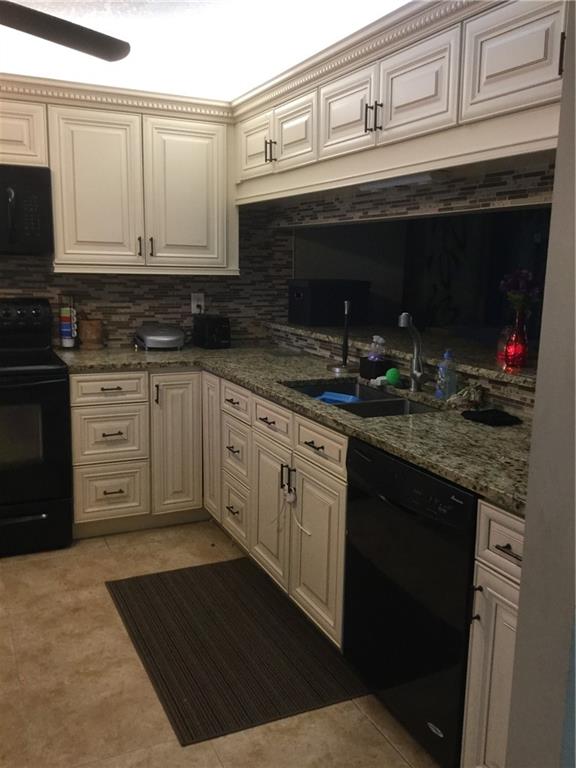 Back on the market due to Buyers loan. Remodeled corner unit in gated community is lovely! Almost 1500 SF of beautiful upgrades include Kitchen cabinets, granite counters, crown molding, chair railing, organized closets and gorgeous tile floors, except in 2 bedrooms that are carpeted. New AC is less than one year. Added benefits of Florida room/den, hurricane accordion shutters and house alarm. Huge laundry room and lots of storage space. Horizontal blinds on all windows and 4 ceiling fans make this home light and bright. Cable, water, tennis and pool included. The community reserves are a little under the 10% lender requirement, therefore a buyer would need 25% down or be able to secure a first mortgage and a 2nd mortgage totaling the 25% down in order to close on the purchase.